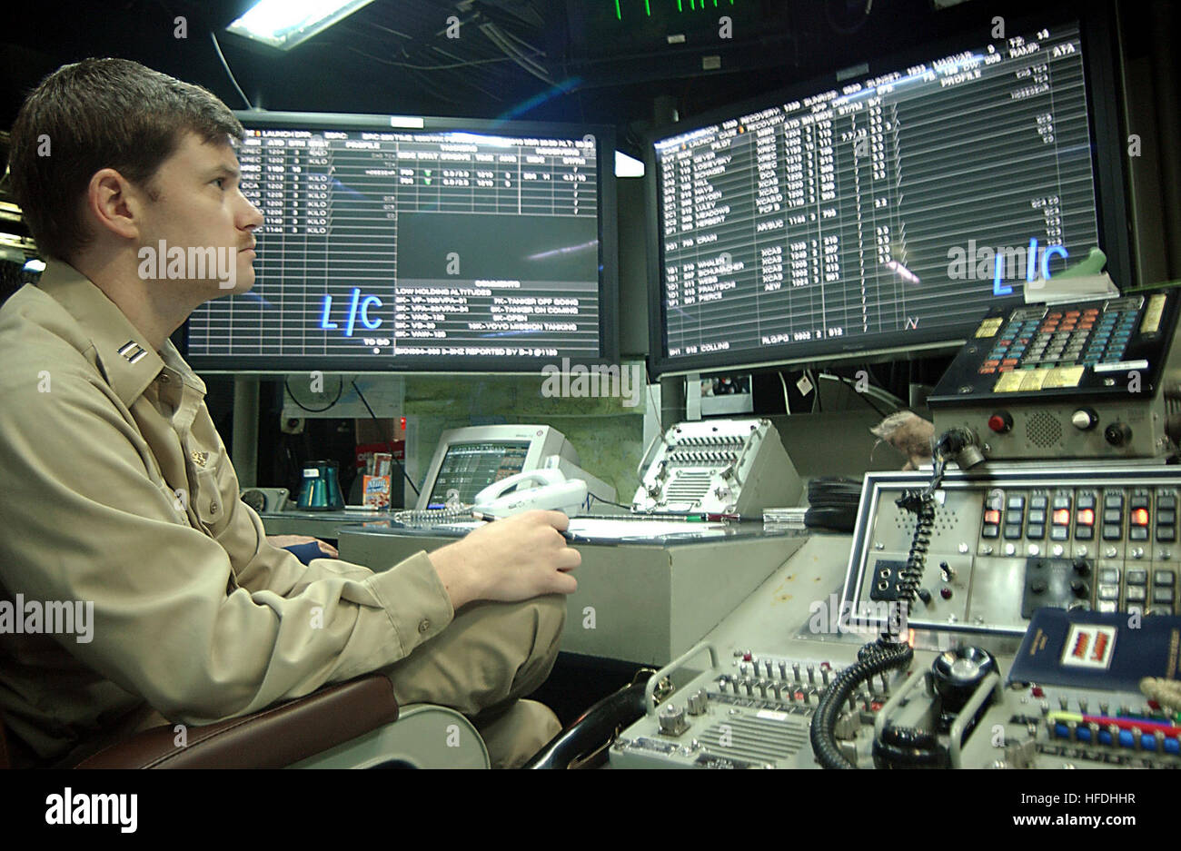 020801-N-7871M-001 At sea aboard USS George Washington  (CVN 73) Aug. 1, 2002 -- Lt. Mark Zinser from San Diego, Calif., uses the aircraft carrier's integrated shipboard information system to monitor aircraft operating in the area while standing watch in the Carrier Air Traffic Control Center (CATCC). Washington and Carrier Air Wing One Seven (CVW-17) are on a regularly scheduled deployment conducting combat missions in support of Operation Enduring Freedom.  U.S. Navy photo by Photographer's Mate Airman Andrew Morrow.  (RELEASED) US Navy 020801-N-7871M-001 Lt. Zinser monitors aircraft operati Stock Photo
