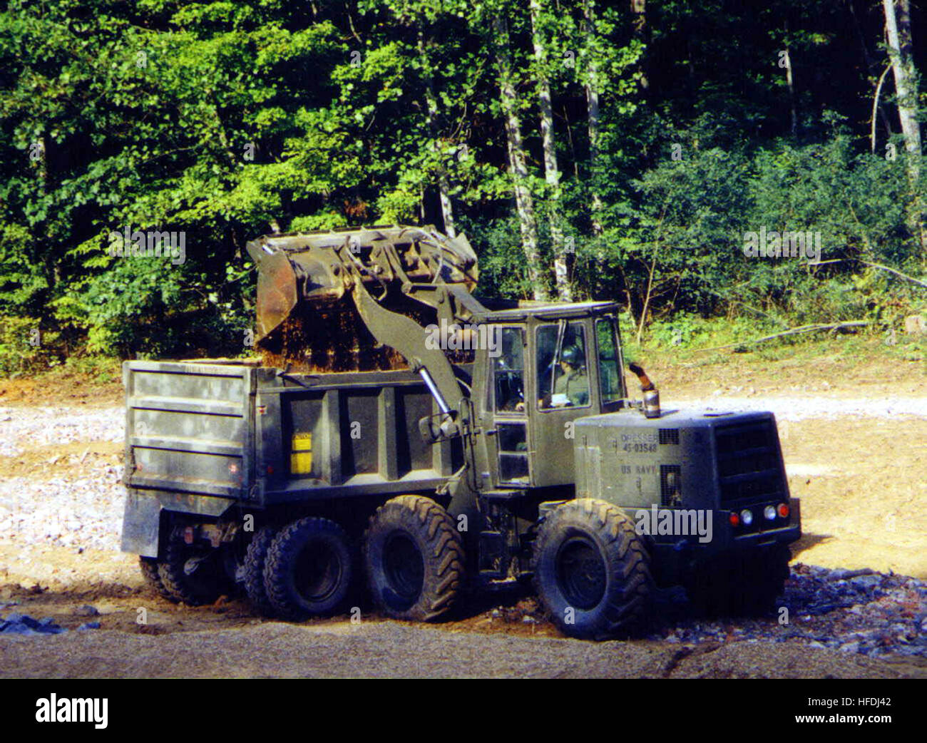 An Equipment Operator with Naval Mobile Construction Battalion 23 ...