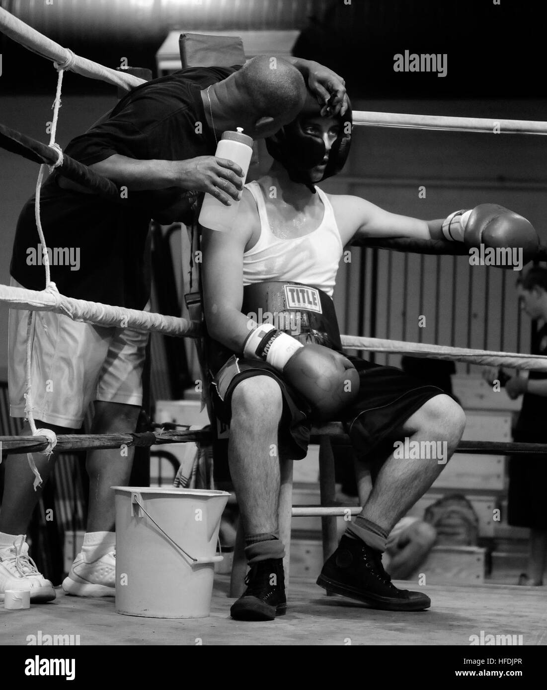 A former Navy boxer coaches participants in a sparring session during ...
