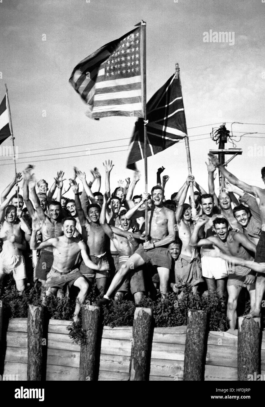 Allied prisoners of war at Aomori camp near Yokohama, Japan, cheer U.S ...