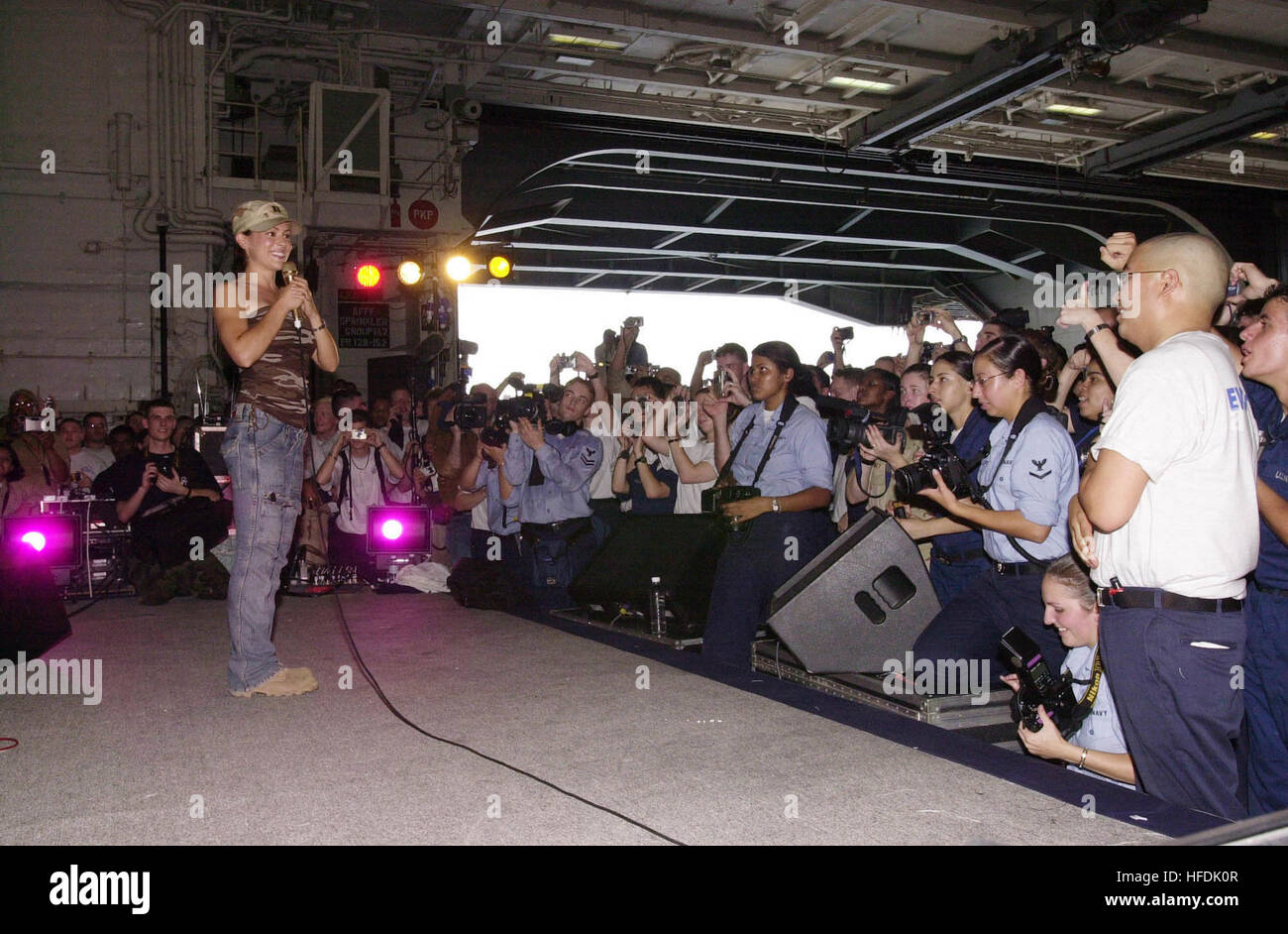 030619-N-2143T-003 The Arabian Gulf (Jun. 19, 2003) -- Actress Alyssa Milano speaks to sailors at the United Service Organization (USO) show during a visit aboard USS Nimitz (CVN 68).  Nimitz Carrier Strike Force and Carrier Air Wing Eleven (CVW-11) are deployed in support of Operation Iraqi Freedom.  Operation Iraqi Freedom is the multi-national coalition effort to liberate the Iraqi people, eliminate IraqÕs weapons of mass destruction, and end the regime of Saddam Hussein.  U.S. Navy photo by Airman Maebel Tinoko.  (RELEASED) Alyssa Milano visits USS Nimitz, june 2003 uncropped Stock Photo