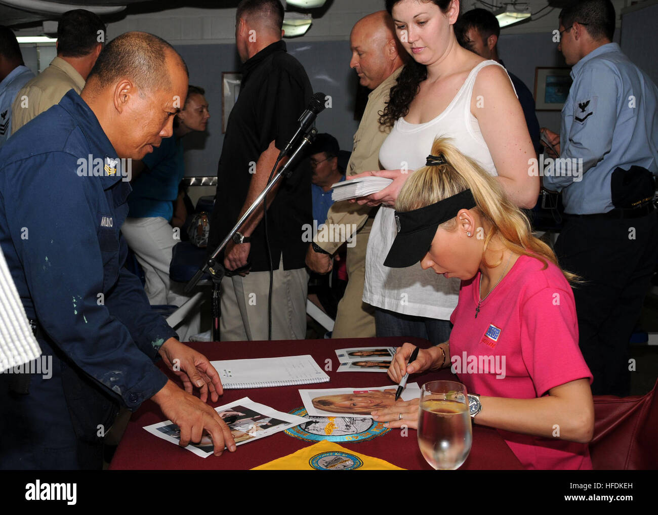 081031-N-1722W-068 Polaris Point, Guam (Oct. 31, 2008) Renowned tennis player and model, Anna Kournikova, signs autographs for Machinist's Repairman 1st Class Reynaldo Milano aboard USS Frank Cable (AS 40). Kournikova's visit to the ship was part of a weeklong trip and USO Goodwill Tour to Guam visiting troops, local groups and their children. (U.S. Navy photoMass Communication Specialist Seaman Trevor Welsh/Released) Anna Kournikova visits Sailors in Guam 125831 Stock Photo