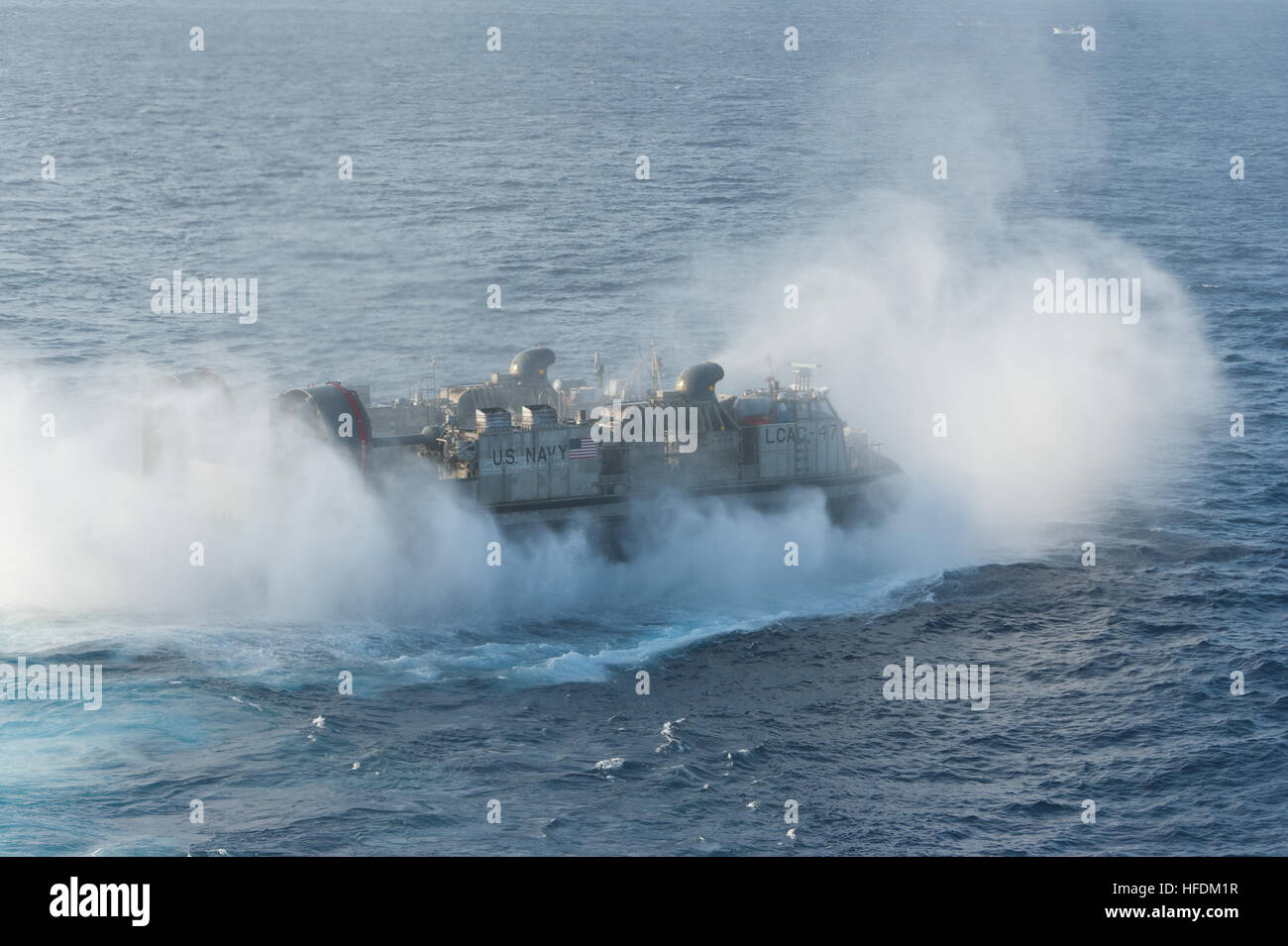 A landing craft air cushion (LCAC) departs the well deck of amphibious ...