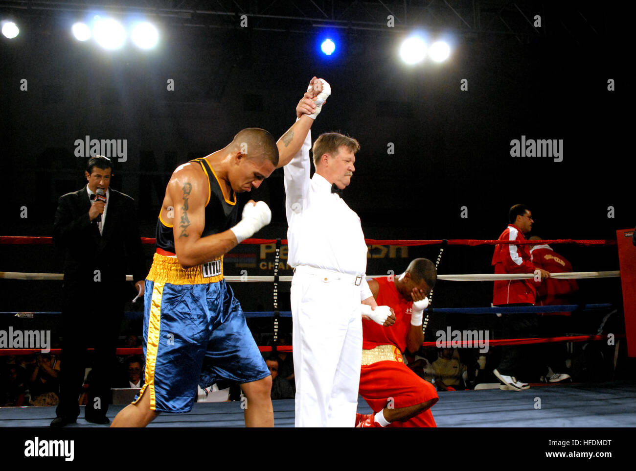 Seaman Justin Diaz, left, is announced the winner of the 141pound weight class as the defeated