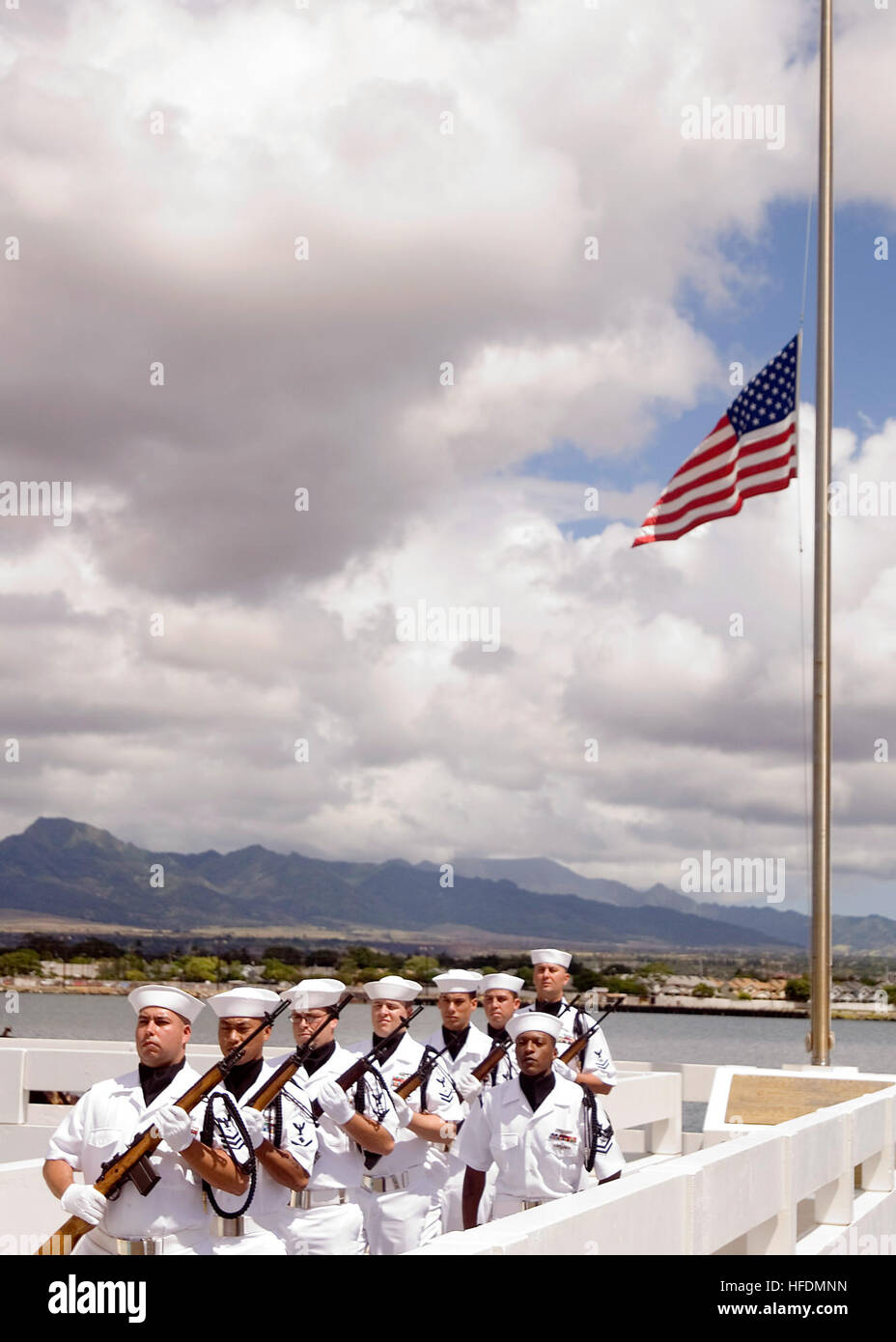 Members of the Navy ceremonial guards post after an interment ceremony at the USS Utah Memorial on Ford Island at Naval Station Pearl Harbor. The ceremony was held to honor Petty Officer First Class Jimmy Oberto, a crewmember of the Florida-class dreadnaught battleship USS Utah during the Pearl Harbor attack. Ashes spread on Ford Island 95088 Stock Photo