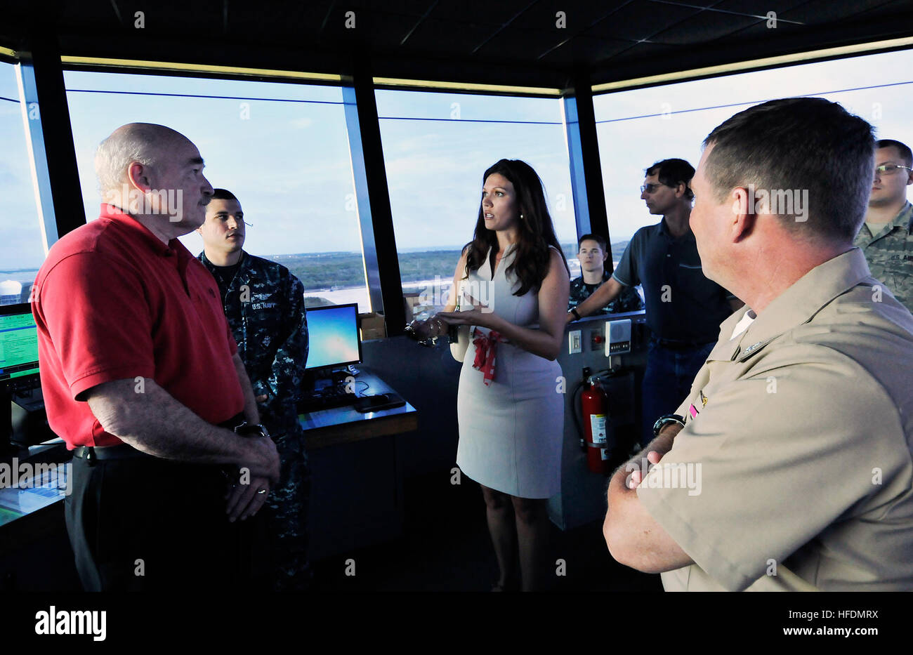 Naval Air Station Key West Community Planning and Liaison Officer Ashley Monnier, center, discusses compatible land use projects with Dennis McGinn, assistant secretary of the Navy for Energy, Installations and Environment, while viewing the airfield from the Boca Chica Field tower. NAS Key West is a state-of-the-art facility for air-to-air combat fighter aircraft of all military services and provides world-class pierside support to U.S. and foreign naval vessels. (U.S. Navy photo by Mass Communication Specialist 1st Class Brian Morales/ Released) Assistant secretary of the Navy visits Key Wes Stock Photo