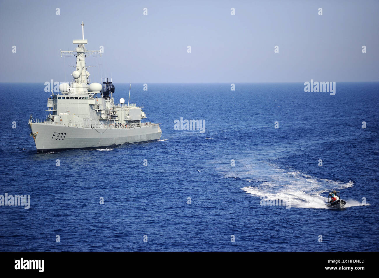 A Portuguese navy visit, board, search and seizure team in a rigid-hull inflatable boat leaves the Portuguese navy frigate NRP Bartolomeu Dias to conduct an inspection of the Military Sealift Command container and roll-on/roll-off ship USNS LCPL Roy M. Wheat during exercise Phoenix Express 2010. Phoenix Express is a two-week exercise designed to strengthen maritime partnership and enhance stability in the region through increased interoperability and cooperation among partners from Africa, Europe and the U.S. (U.S. Navy photo by Mass Communication Specialist 2nd Class Jimmy C. Pan/Released) A  Stock Photo