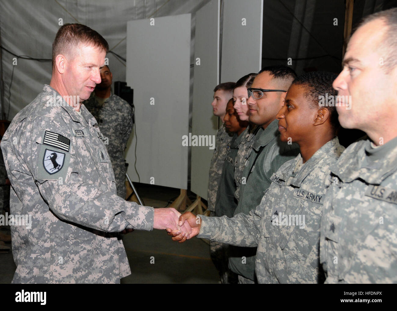 091207-N-9247P-017 - CAMP EGGERS, Afghanistan – Sergeant Major of the Army Kenneth Preston shakes hands with Soldiers of NATO Training Mission – Afghanistan at Camp Eggers Dec. 7, 2009. During his visit, Preston responded to the Soldiers questions and concerns, presented ceremonial coins, and thanked them for their service. (U.S. Navy photo by Mass Communication Specialist 3rd Class Kirk Putnam/RELEASED) 091207-N-9247P-017 (4167004864) Stock Photo