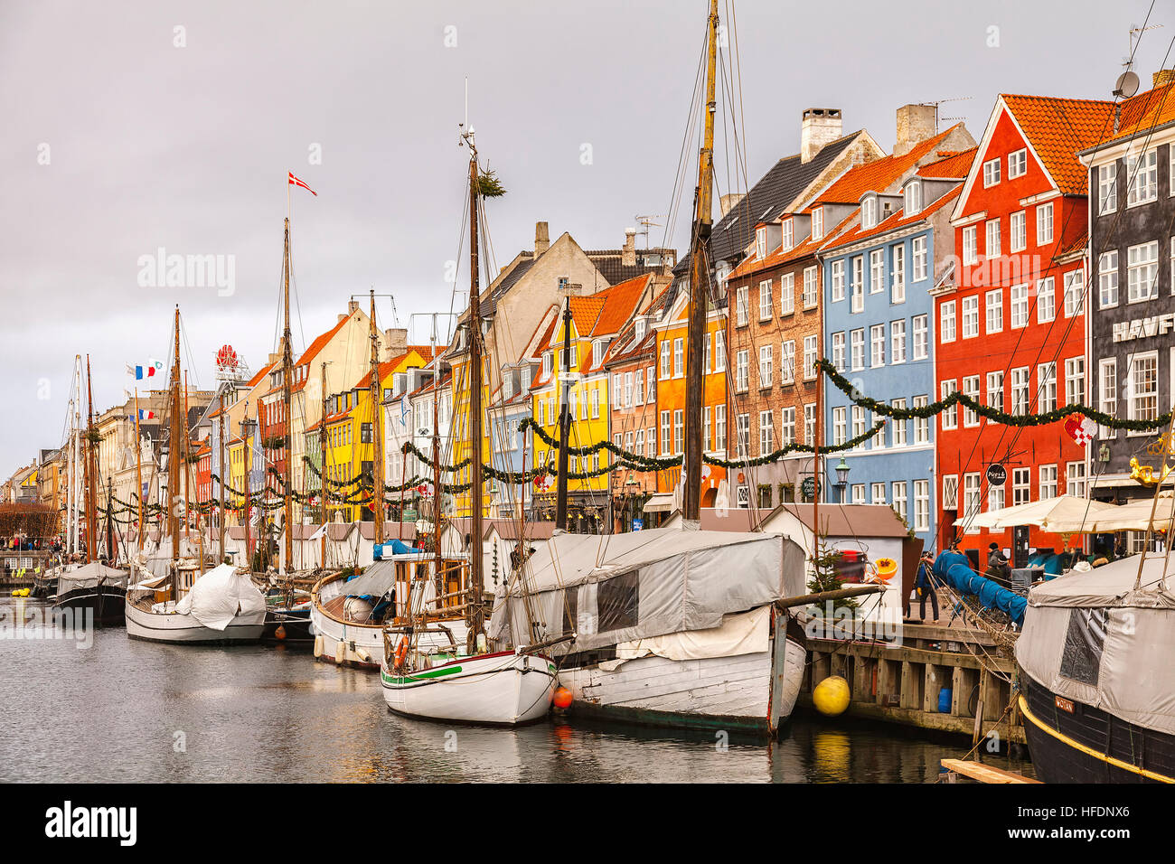 Ships and colourful buildings in the Nyhavn area of Copenhagen. Stock Photo