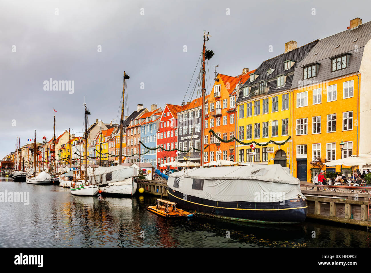 Ships and colourful buildings in the harbour area of Nyhavn. Stock Photo