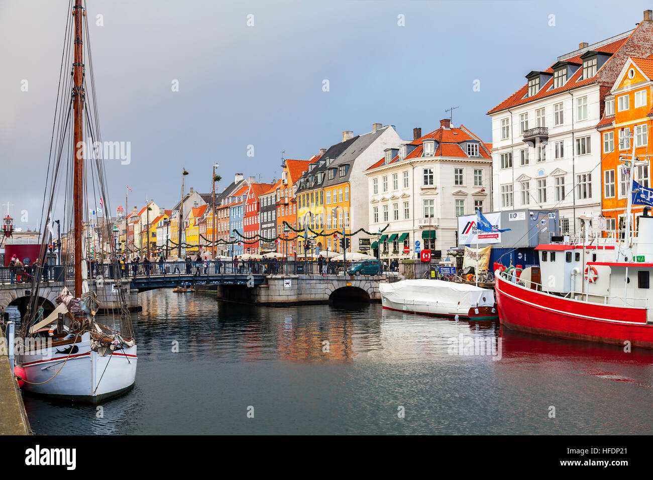 Ships and colourful buildings in the Nyhavn area of Copenhagen. Stock Photo