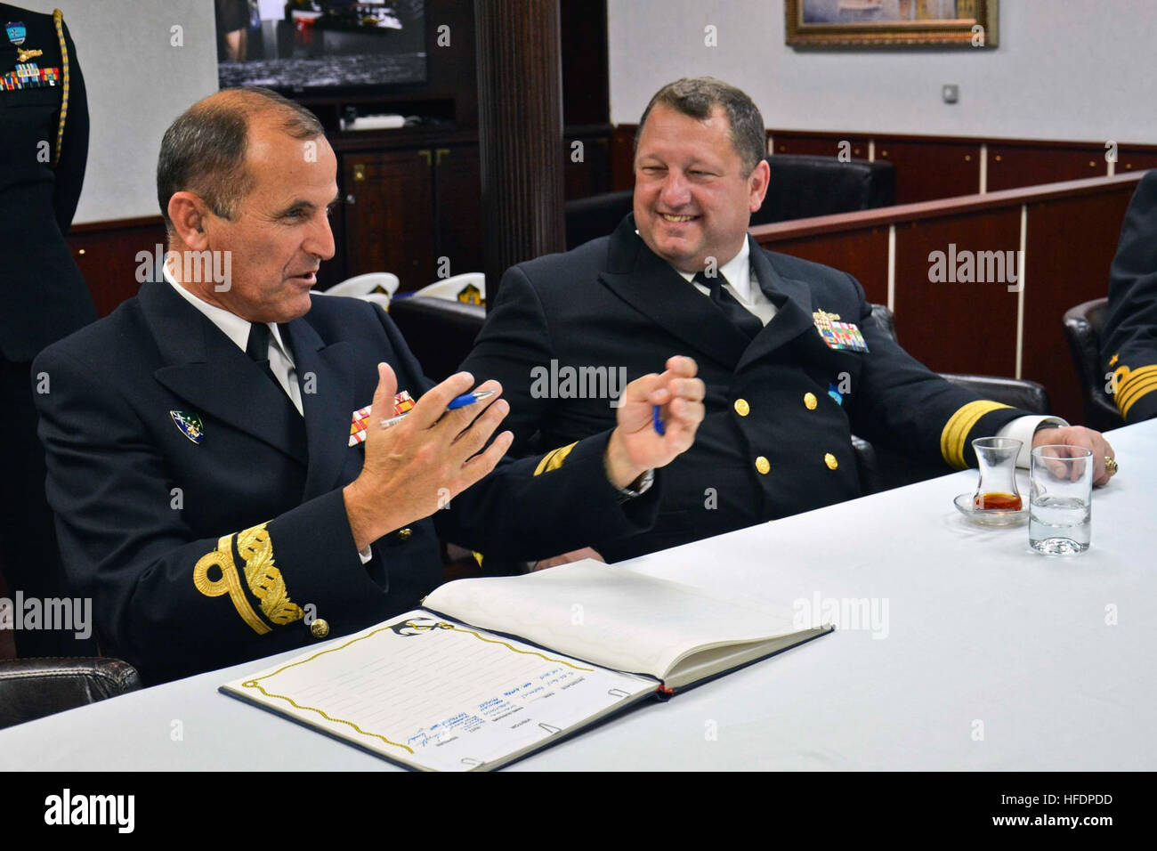 150605-N-IY633-120 GDYNIA, Poland (June 5, 2015) – Deputy Chief of Staff, Operations, Naval Striking and Support Forces NATO, Rear Adm. Juan Garat, left; speaks with Commander, Standing NATO Maritime Group 2 (SNMG2), Rear Adm. Brad Williamson; aboard SNMG2 Turkish ship TCG Göksu (F 497) during SNMG2’s port visit to the city in preparation for exercise Baltic Operations (BALTOPS). BALTOPS is an annually reoccurring multinational exercise designed to enhance flexibility and interoperability, as well as demonstrate resolve of Allied and partner forces to defend the Baltic region. (U.S. Navy photo Stock Photo