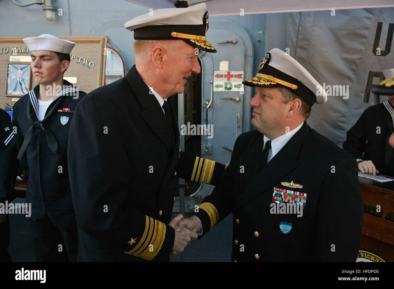 150605-N-IY633-208 GDYNIA, Poland (June 5, 2015) – Commander, Standing NATO Maritime Group 2 (SNMG2), Rear Adm. Brad Williamson, right; welcomes Commander, Naval Striking and Support Forces NATO, Vice Adm. James Foggo aboard SNMG2 flagship USS Vicksburg (CG 69) for a reception during SNMG2’s port visit to the city in preparation for exercise Baltic Operations (BALTOPS). BALTOPS is an annually reoccurring multinational exercise designed to enhance flexibility and interoperability, as well as demonstrate resolve of Allied and partner forces to defend the Baltic region. (U.S. Navy photo by Mass C Stock Photo