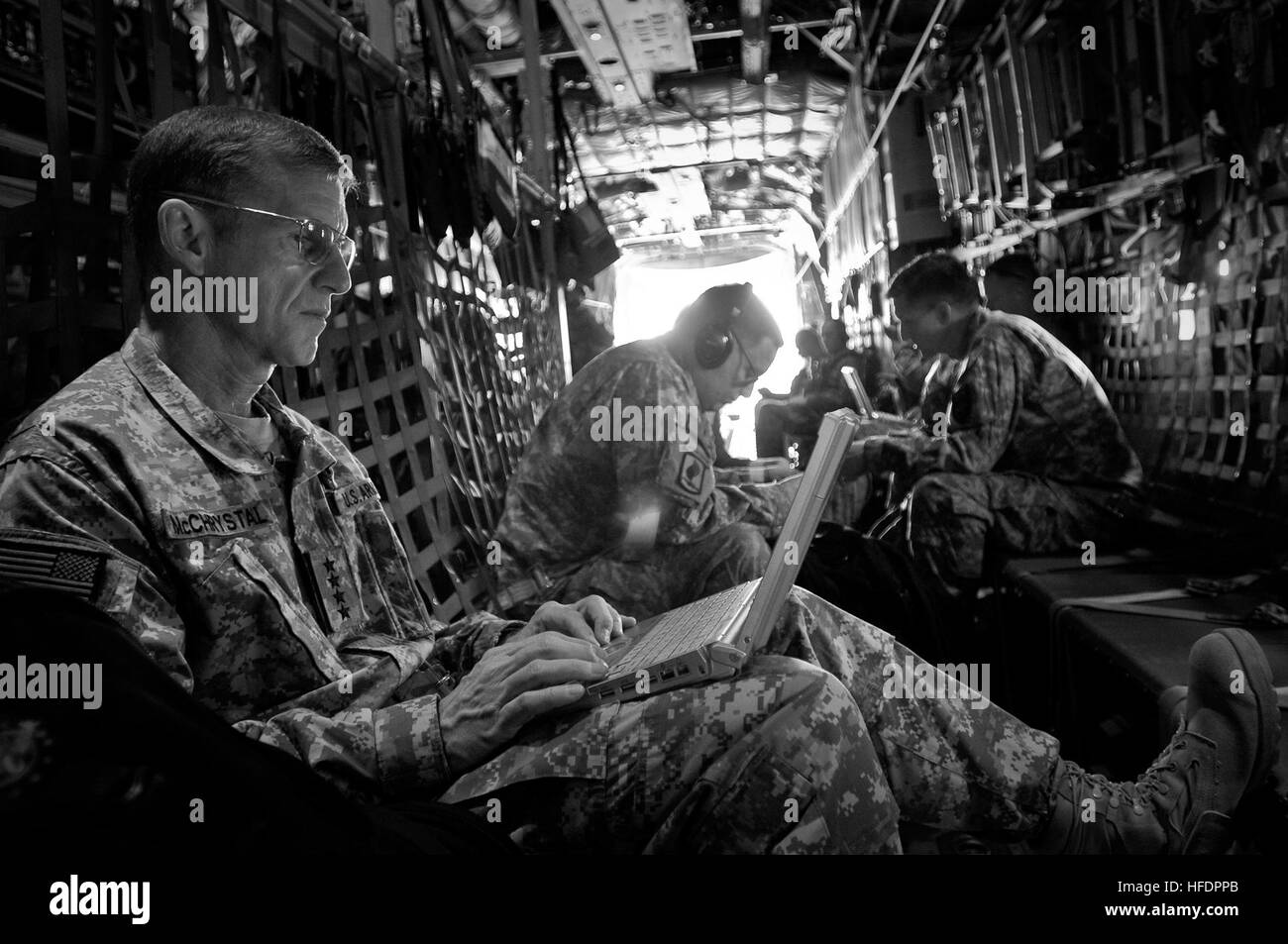 U.S. Army Gen. Stanley A. McChrystal, commander of NATO's International Security Assistance Force and U.S. Forces-Afghanistan, works on board a Lockheed C-130 Hercules aircraft between Battlefield Circulation missions. Battlefield Circulation 270121 Stock Photo
