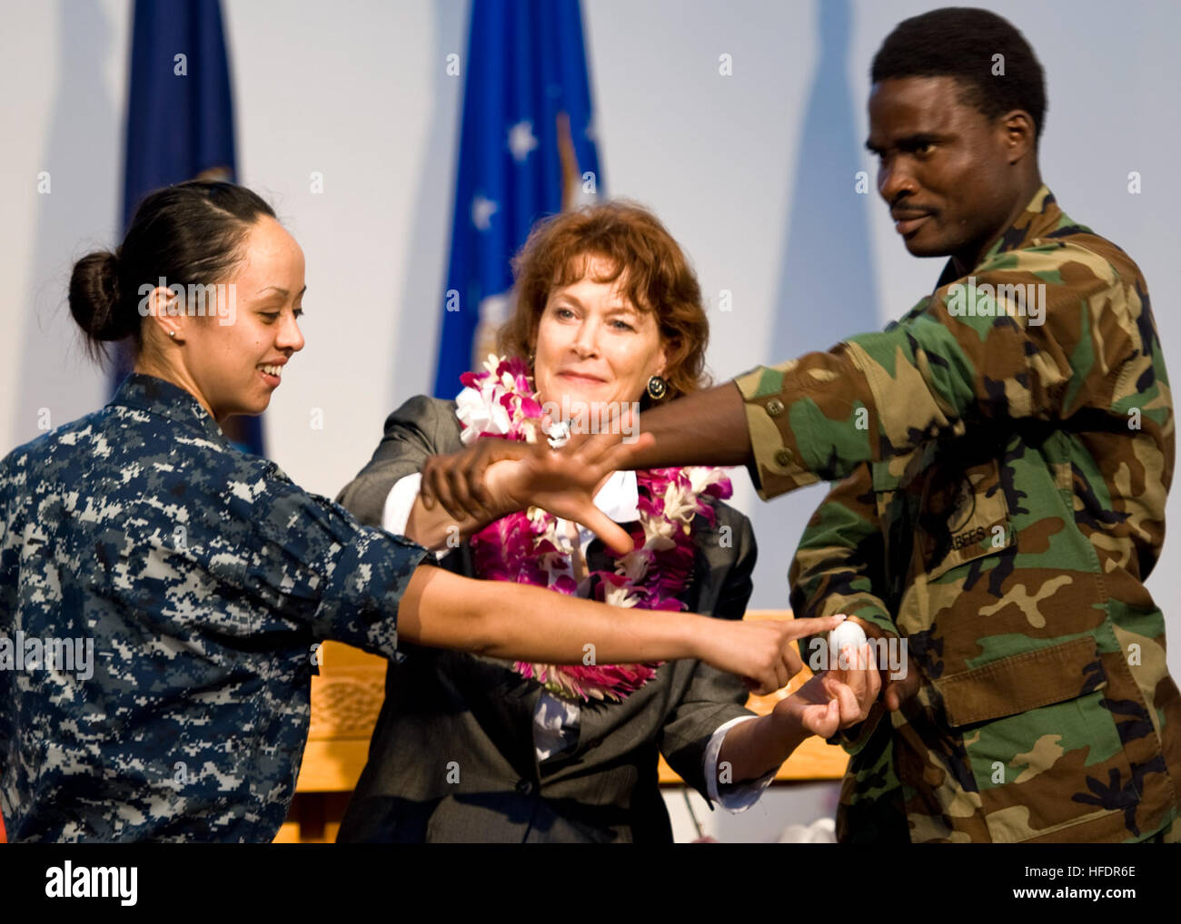 Guest speaker Beth Terry demonstrates with U.S. Navy sailors how energy