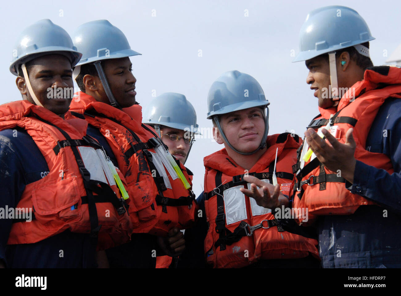Deck seamen aboard the amphibious command ship USS Blue Ridge phone and