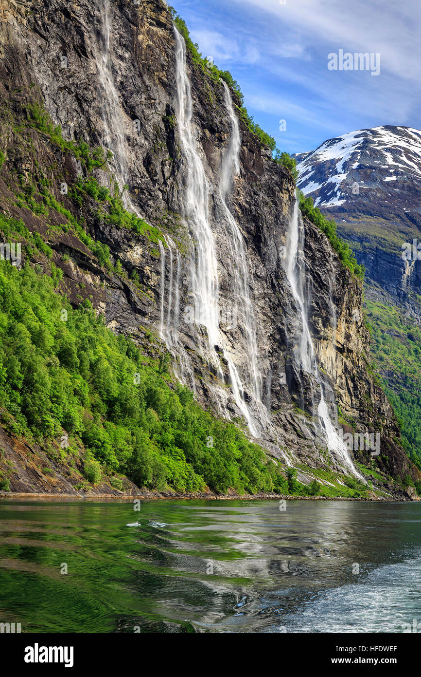 Reflections and waterfall along the Geirangerfjorden, Norway Stock Photo