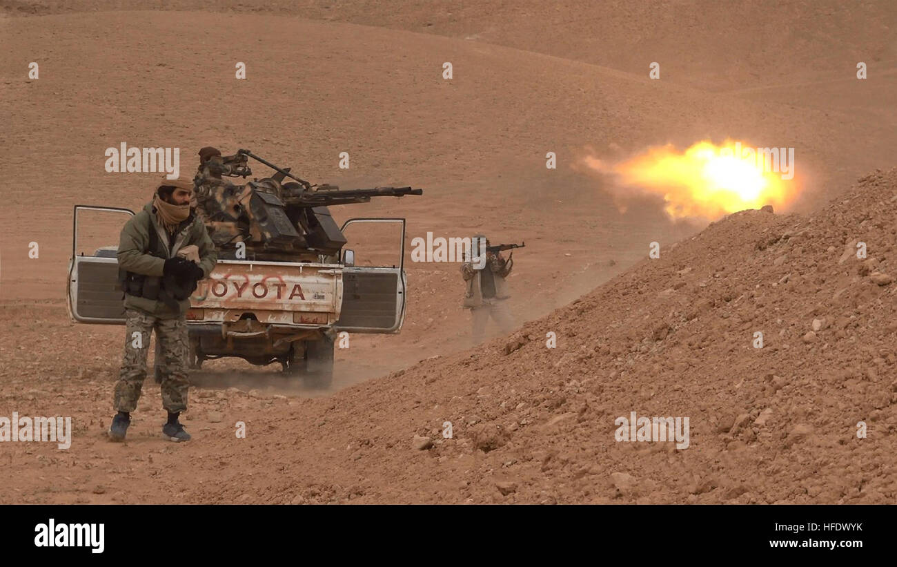 Still image taken from an ISIS propaganda video showing a technical vehicle outfitted with a heavy machine gun operated by Islamic State militants during battles against the Syrian Army December 10, 2016 in Homs province, Syria. Stock Photo