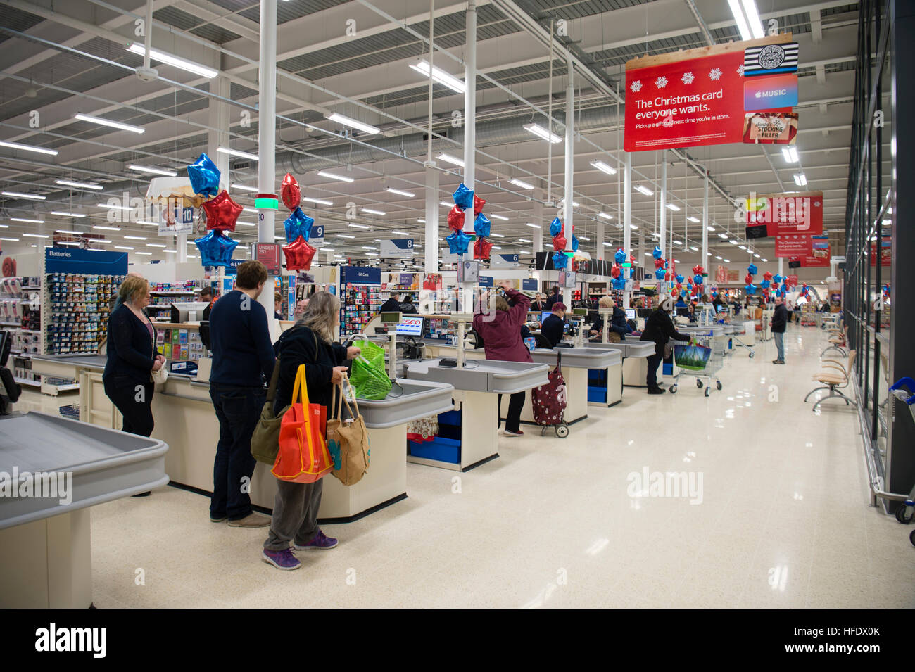 Supermarket checkout: People shopping in the Tesco supermarket superstore, Aberystwyth Wales UK (on the opening day of the store 24 November 2016) Stock Photo