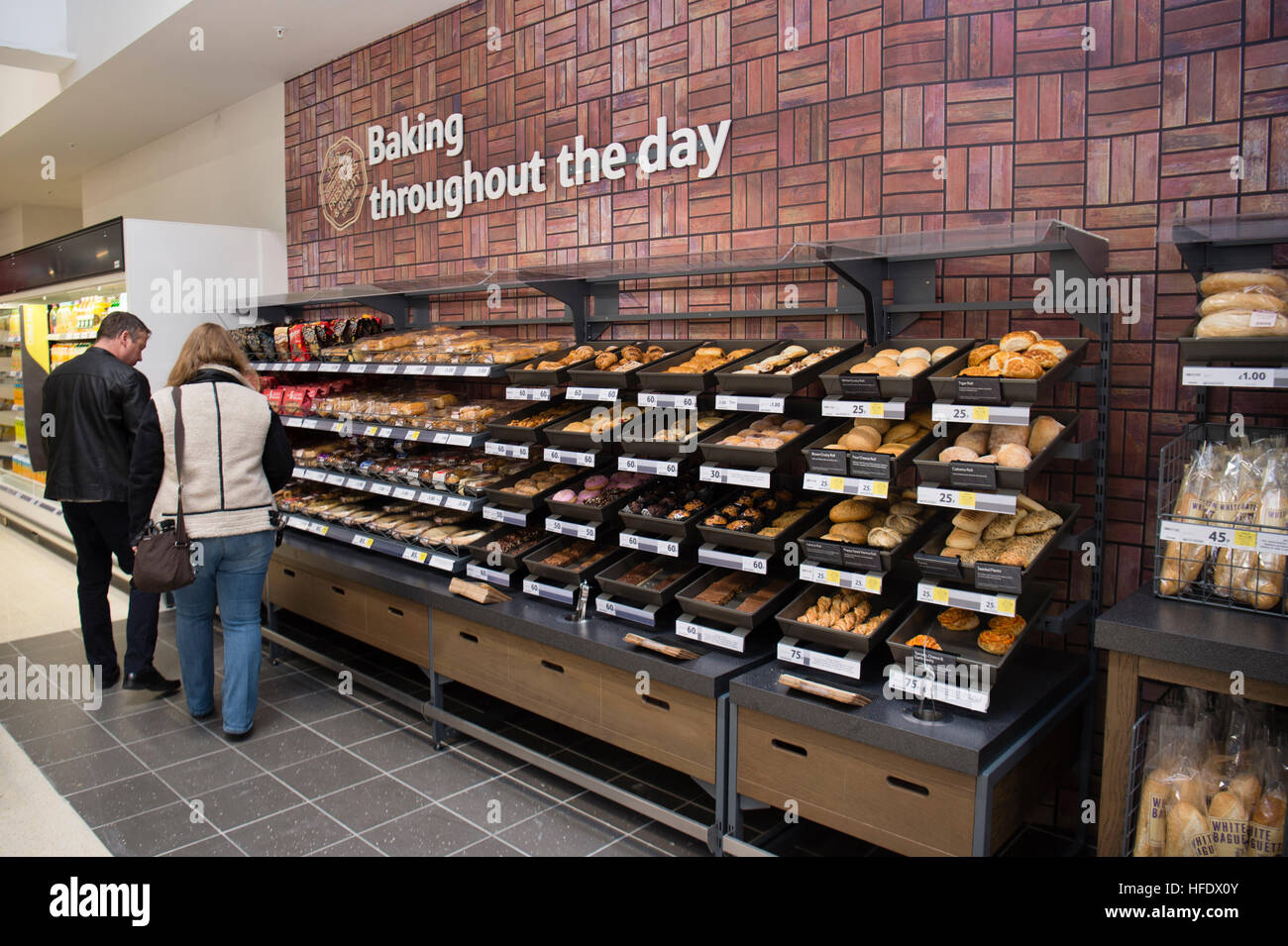 People shopping for bakery products in the Tesco supermarket superstore, Aberystwyth Wales UK (on the opening day of the store 24 November 2016) Stock Photo
