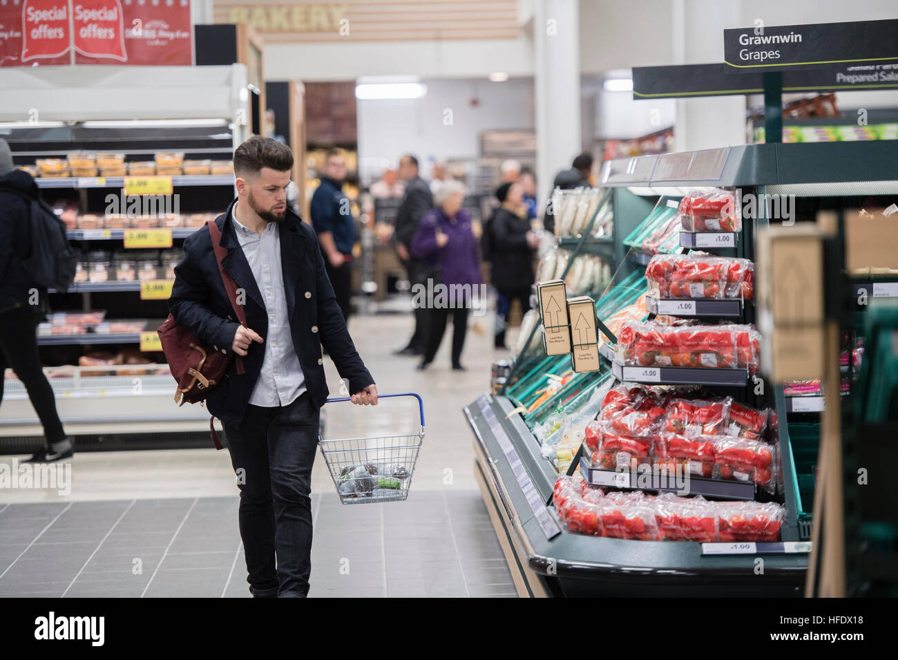 People shopping in the Tesco supermarket superstore, Aberystwyth Wales