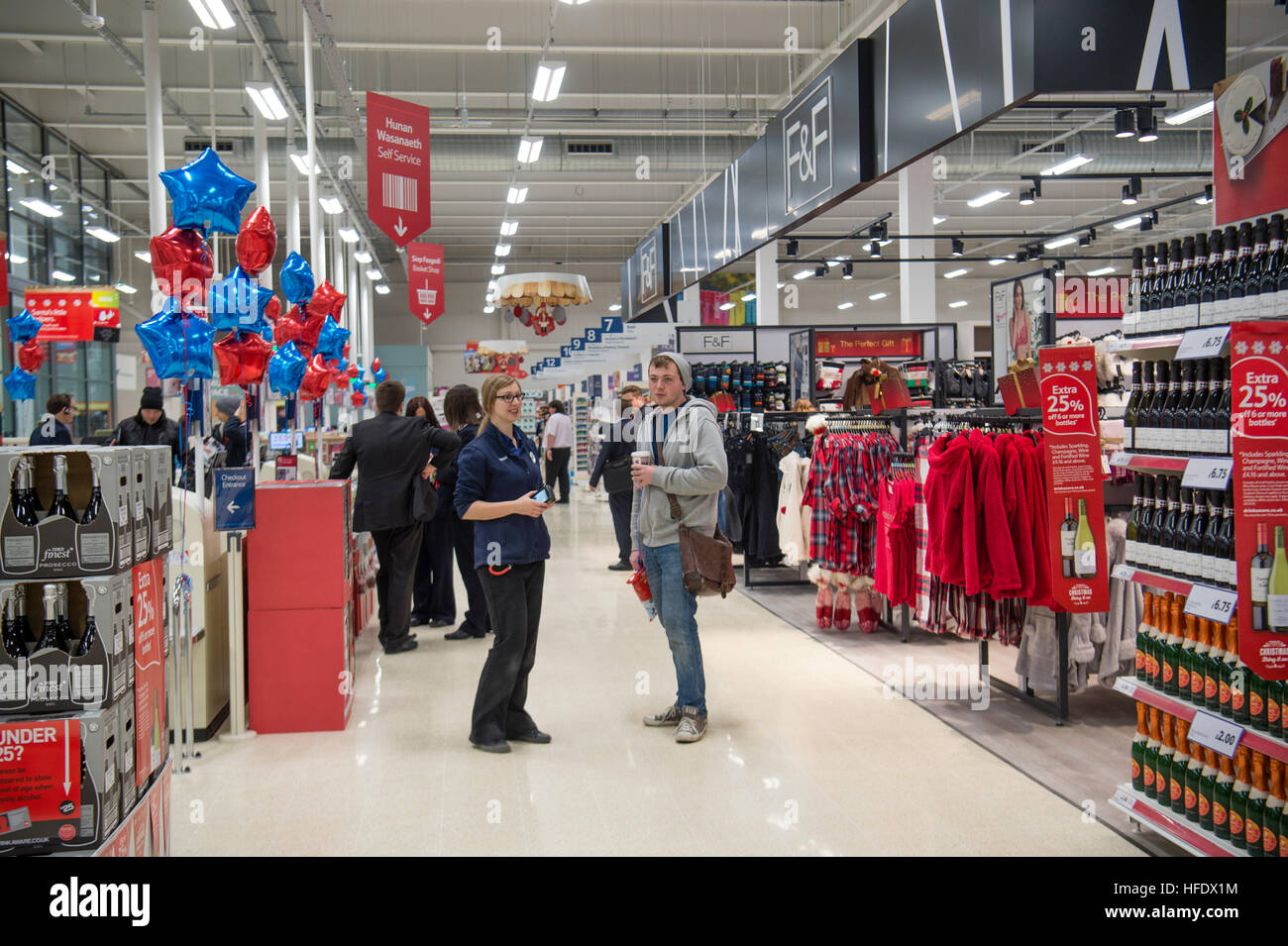 People shopping in the Tesco supermarket superstore, Aberystwyth Wales UK (on the opening day of