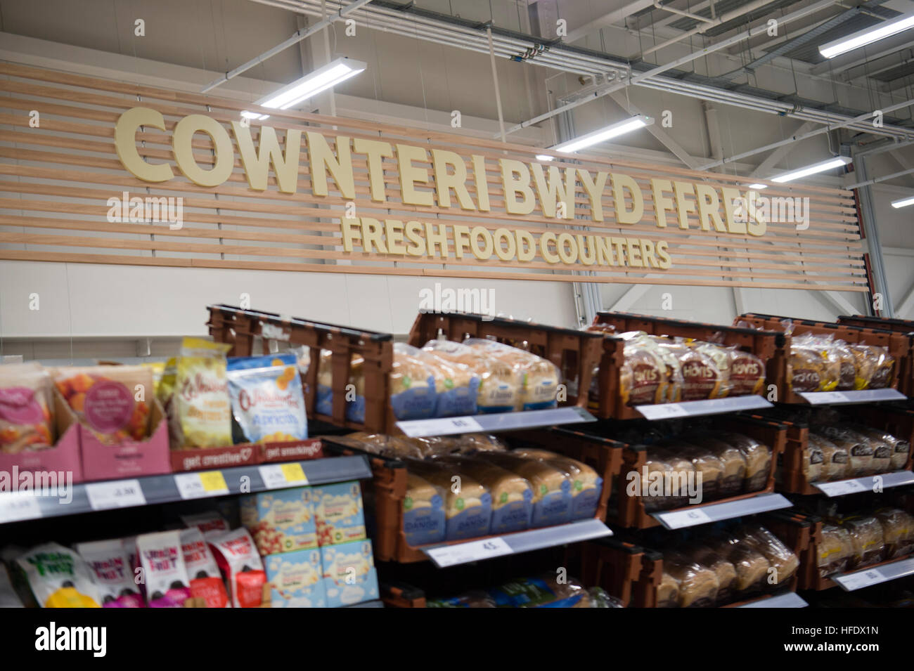 Bilingual welsh and english signage in the Tesco supermarket superstore, Aberystwyth Wales UK