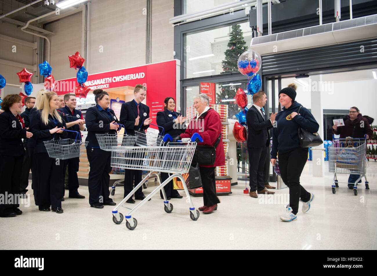 Staff (colleagues) lined up to greet and applaud people shopping in the Tesco