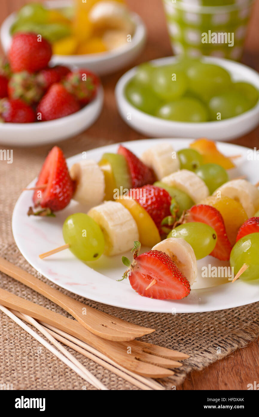 assorted fruit skewers with grapes, kiwi, banana, strawberry and plum Stock Photo Alamy
