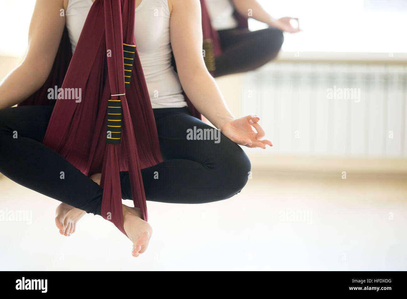 Sukhasana yoga pose in hammocks Stock Photo Alamy