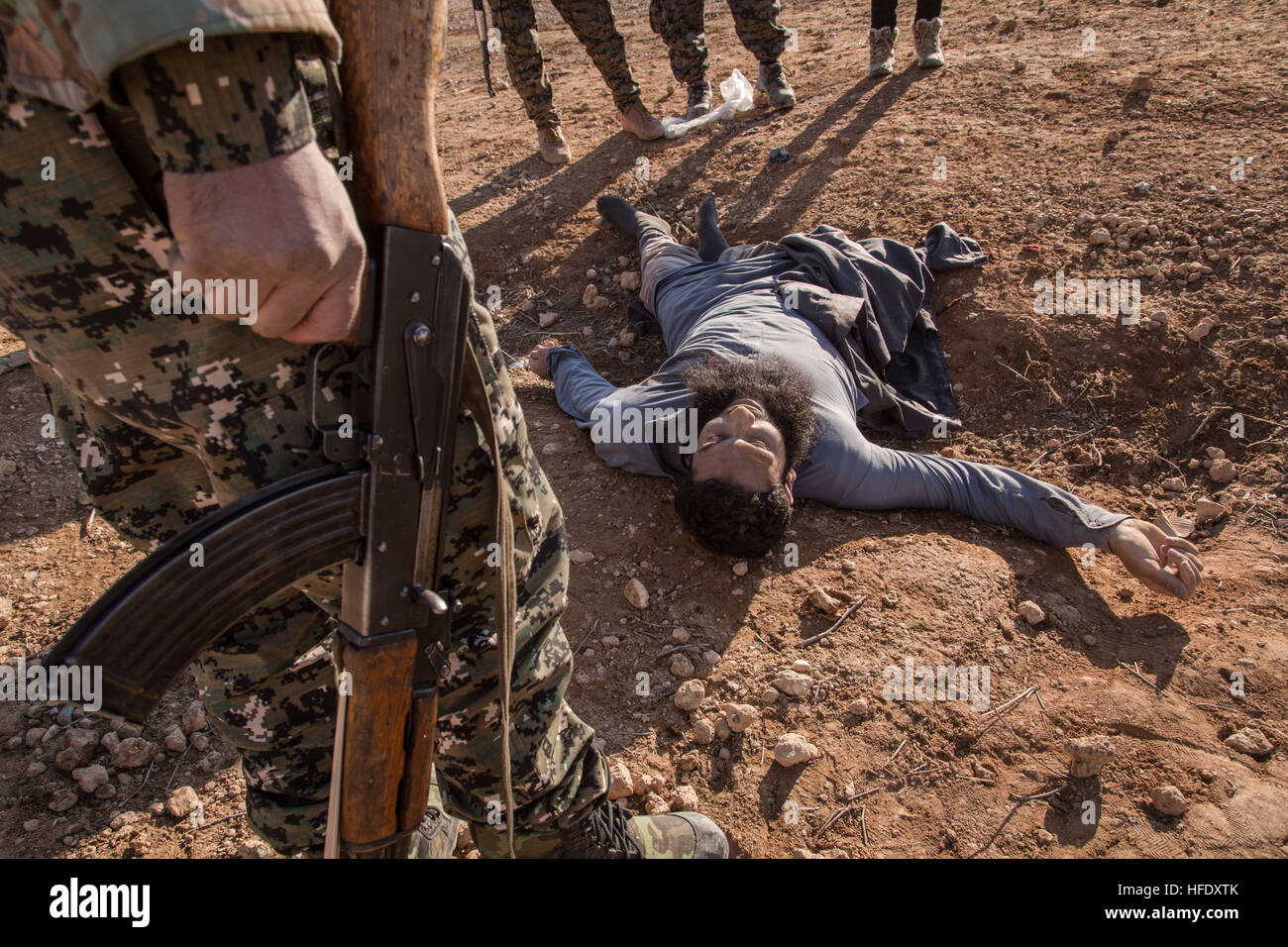 Going to Raqqa -  19/12/2016  -  Syria  -  SYRIA / ROJAVA / SHE BHER village - A dead body of a memeber of ISIS - the YPG platoon has just liberate the village from ISIS, this place is not far from Raqqa.   -  Chris Huby / Le Pictorium Stock Photo