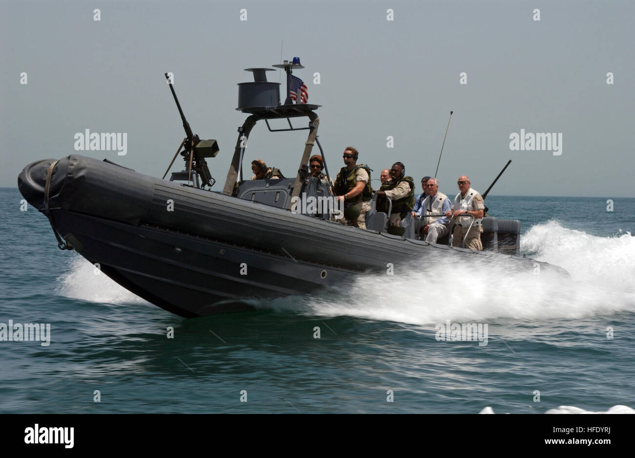 040520-N-7586B-057 Arabian Gulf  (May 20, 2004) - Riding in a Rigid Hull Inflateable Boat (RHIB), Secretary of the Navy, Gordon R. England, is transported from the Al Basrah Oil Terminal (ABOT) to the coastal patrol ship USS Chinook (PC 9), by members assigned to Special Boat Team Twelve (SBT-12). Secretary England expressed his support during a scheduled tour of deployed locations, speaking with the troops stationed in the U.S. Central Command's Area of Responsibility. U.S. Navy photo by Photographer's Mate 1st Class Bart A. Bauer (RELEASED) US Navy 040520-N-7586B-057 Riding in a Rigid Hull I Stock Photo
