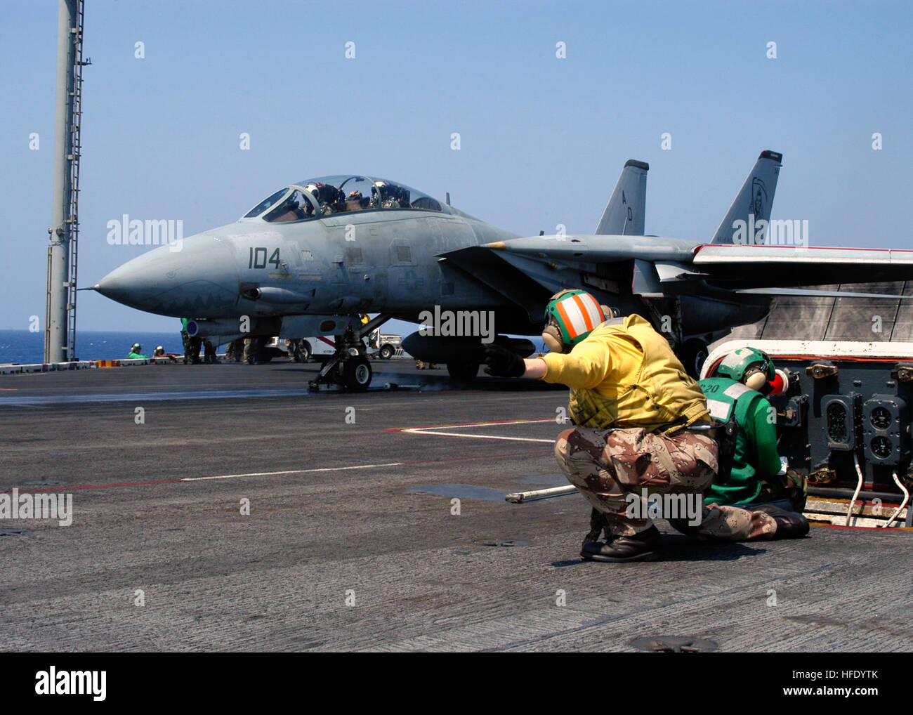 040521-N-7090S-002 Atlantic Ocean (May 21, 2004) - On the flight deck aboard USS Enterprise (CVN 65), a catapult officer gives the signal to launch an F-14 Tomcat assigned to the 'Grim Reapers' of Fighter Squadron One Zero One (VF-101). This will be the last time F-14s conduct operations from the flight deck of USS Enterprise. The Naval Air Station Oceana-based squadron is aboard Enterprise completing routine carrier qualifications. U.S. Navy photo by Photographer's Mate Airman Jhi L. Scott (RELEASED) US Navy 040521-N-7090S-002 On the flight deck aboard USS Enterprise (CVN 65), a catapult offi Stock Photo