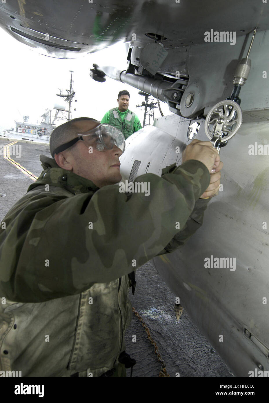 040607-N-7748K-027 Atlantic Ocean (June 7, 2004)--Aviation Structural Mechanic Airman Morris L. Rodrigues of Espanol, N.M. perfoms an inspection on an F/A-18 Hornet. Official  U.S. Navy photo by Photographer's Mate Airman Joshua Kinter. Image released by LT K.R. Stevens, PAO CVN-65. US Navy 040607-N-7748K-027 Aviation Structural Mechanic Airman Morris L. Rodrigues of Espanol, N.M. performs a maintenance inspection on an F-A-18 Hornet aboard USS Enterprise (CV 65) Stock Photo