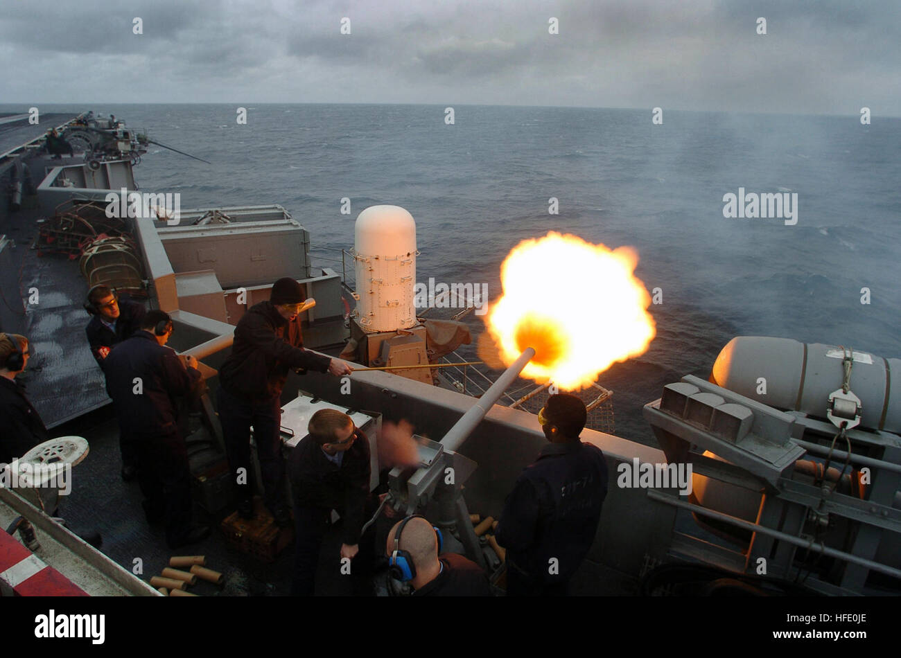 040611-N-6213R-038 Gulf of Alaska (Jun. 11, 2004) - On the flight deck aboard USS John C. Stennis (CVN 74), sailors perform a 21-gun salute in honor of former President Ronald Reagan on the day of his final internment at the Reagan Presidential Library, in Simi Valley, Calif. Ronald Reagan, the 40th U.S. President of the United States, passed away recently after a long battle with Alzheimer's Disease. Stennis and embarked Carrier Air Wing Fourteen (CVW-14) are at sea participating in Exercise Northern Edge, part of a scheduled deployment. U.S. Navy photo by Photographer's Mate 3rd Class Mark J Stock Photo