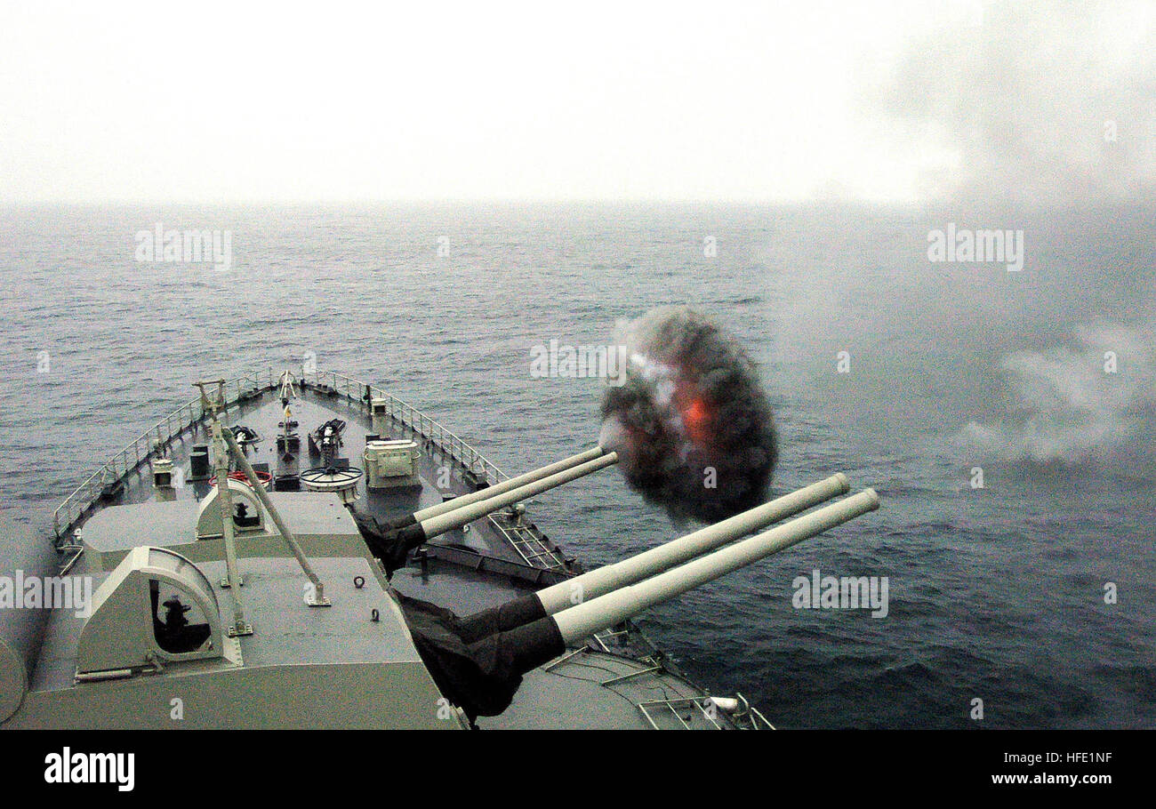 040703-N-1464F-001 Salinas, Peru (July 3, 2004) - The Peruvian cruiser Almirante Grau (CLM-81) fires one of its 15.2 cm caliber cannons as naval surface fire support during a Latin American amphibious assault exercise supporting UNITAS 45-04.  Eleven partner nations from the U.S. and Latin America came together for the largest multilateral exercise in the Southern Hemisphere. Held since 1959, UNITAS aims to unite military forces throughout the Americas with bilateral and multilateral shipboard, amphibious and in-port exercises and operations. UNITAS improves operational readiness and interoper Stock Photo