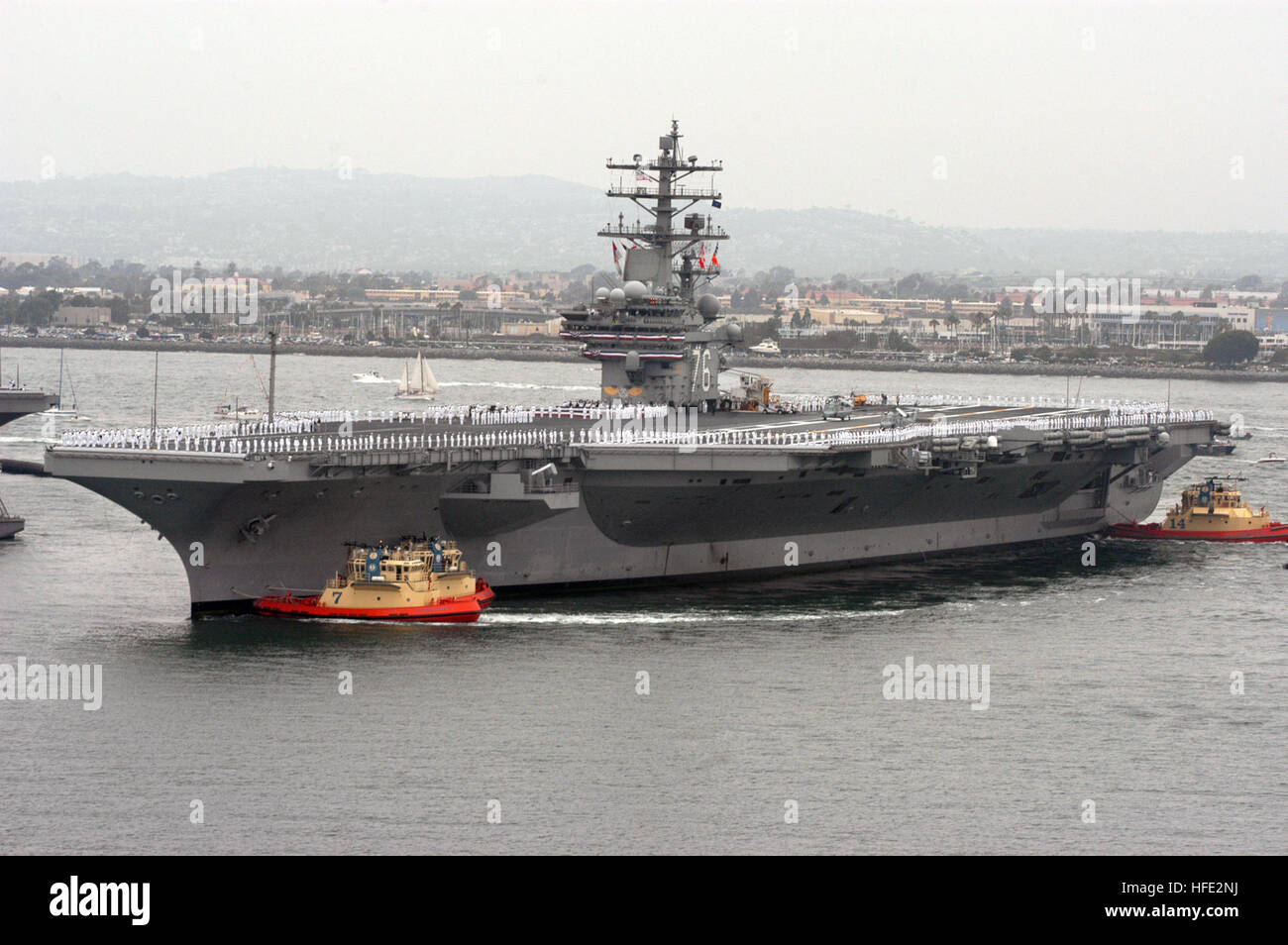 040723-N-8076M-096 San Diego, Calif. (Jul. 23, 2004) - The Navy's newest and most technologically advanced aircraft carrier USS Ronald Reagan (CVN 76), enters San Diego harbor for a homeporting celebration, welcoming the ship to San Diego, Calif., and officially joining the U.S. Pacific Fleet. The celebration will include various dignitaries, including former First Lady Nancy Reagan, members of the Congress, state officials and celebrities. Commanded by Capt. James A. Symonds, the ship was commissioned in July 2003, and is completing a two-month transit around South America to her new homeport Stock Photo