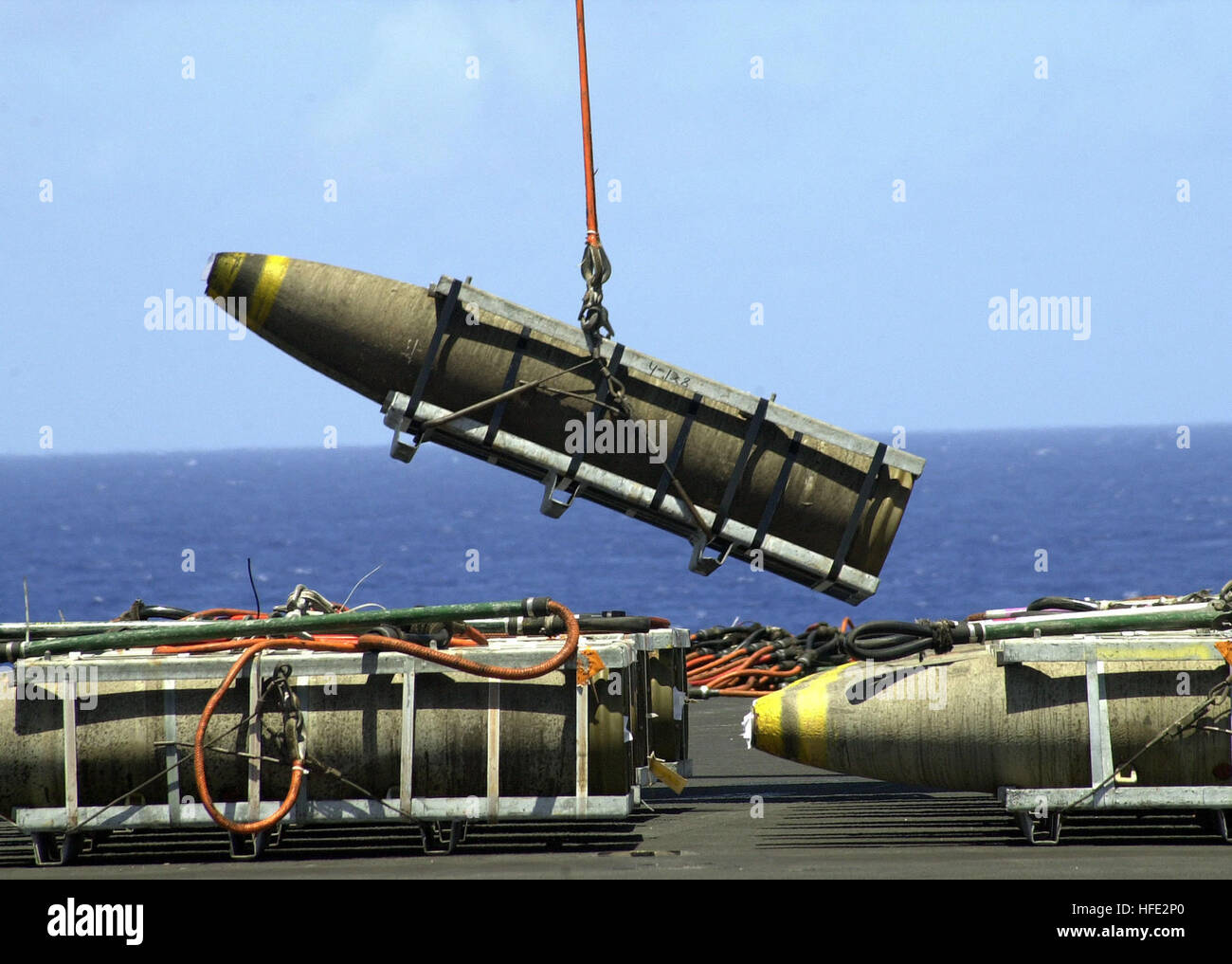 030515-N-0295M-007 The Pacific Ocean (May 15, 2003) -- 2,000-lb. bombs are offloaded from the flight deck aboard USS Constellation (CV 64) during the ConstellationÕs ammunitions offload. Constellation and Carrier Air Wing Two (CVW-2) are returning from deployment in support of Operations Southern Watch, Enduring and Iraqi Freedom.  U.S. Navy photo by Photographer's Mate 2nd Class Daniel J. McLain.  (RELEASED) US Navy 030515-N-0295M-007 2,000-lb. bombs are offloaded from the flight deck aboard USS Constellation (CV 64) during the Constellation%%5Ersquo,s ammunitions offload Stock Photo