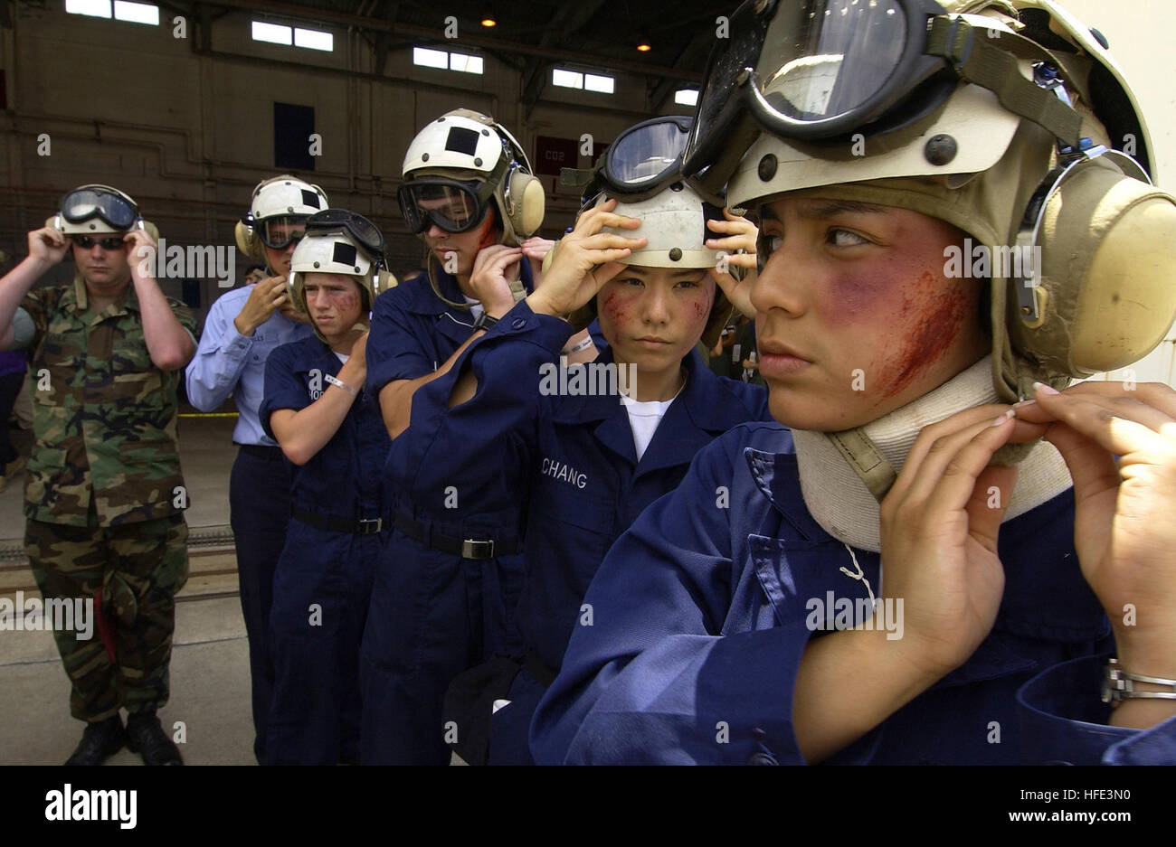 050526-F-6655M-164 Pensacola, Fla (May 26, 2005) - Navy ÒA SchoolÓ students assigned to Naval Air Station Pensacola, Fla., don safety helmets and goggles before loading into a CH-3 transport helicopter during exercise Lifesaver 2005. The exercise is based on an oil refinery explosion involving more than 200 patients and medical airlift from three different branches of the armed forces. Military personnel join local, state and federal agencies in Lifesaver 2005, a major Homeland Security/National Disaster Medical System exercise being conducted in eight states. U.S. Air Force photo by Tech. Sgt Stock Photo
