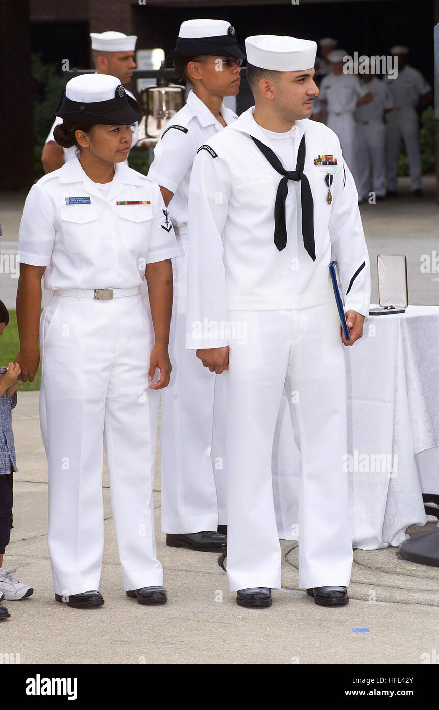 040811-N-0000N-006 Camp Lejeune, N.C. (Aug. 11, 2004) – Hospitalman Apprentice Luis E. Fonseca, Jr., stands with his spouse shortly after Secretary of the Navy, Gordon R. England presented Seaman Apprentice Fonseca with the Navy Cross for heroism during the battle of An Nasiriyah, Iraq, in March 2003. Under attack and without concern for his own safety, Hospitalman Apprentice Fonseca braved small arms, machine gun, and intense rocket-propelled grenade fire to evacuate wounded Marines from a burning amphibious assault vehicle. He stabilized two casualties with lower limb amputations with tourni Stock Photo