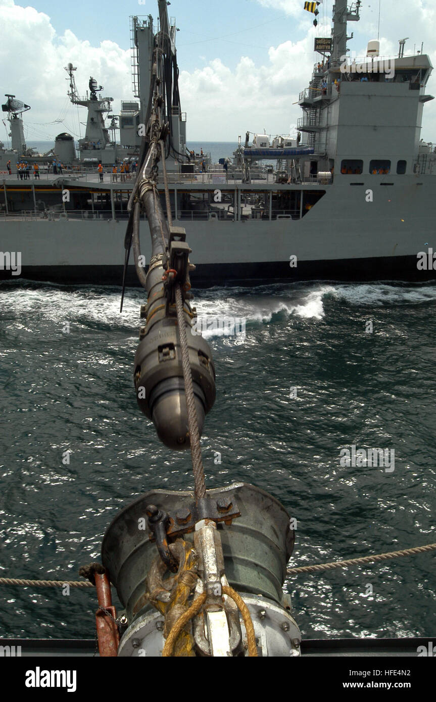 041005-N-0021M-014 Off the coast of India (Oct. 5, 2004) Ð A refueling probe from the Indian Navy replenishment and repair ship INS Aditya (A 59), is guided into a fueling receiver aboard the guided missile frigate USS Gary (FFG 51) during exercise Malabar 04. Malabar is designed to increase interoperability between the two navies while enhancing the cooperative security relationship between India and the United States. The at-sea exercise includes maritime interdiction, surface events, sub-surface, air events and personnel exchanges. U.S. Navy photo by Journalist 1st Class Todd Macdonald (REL Stock Photo