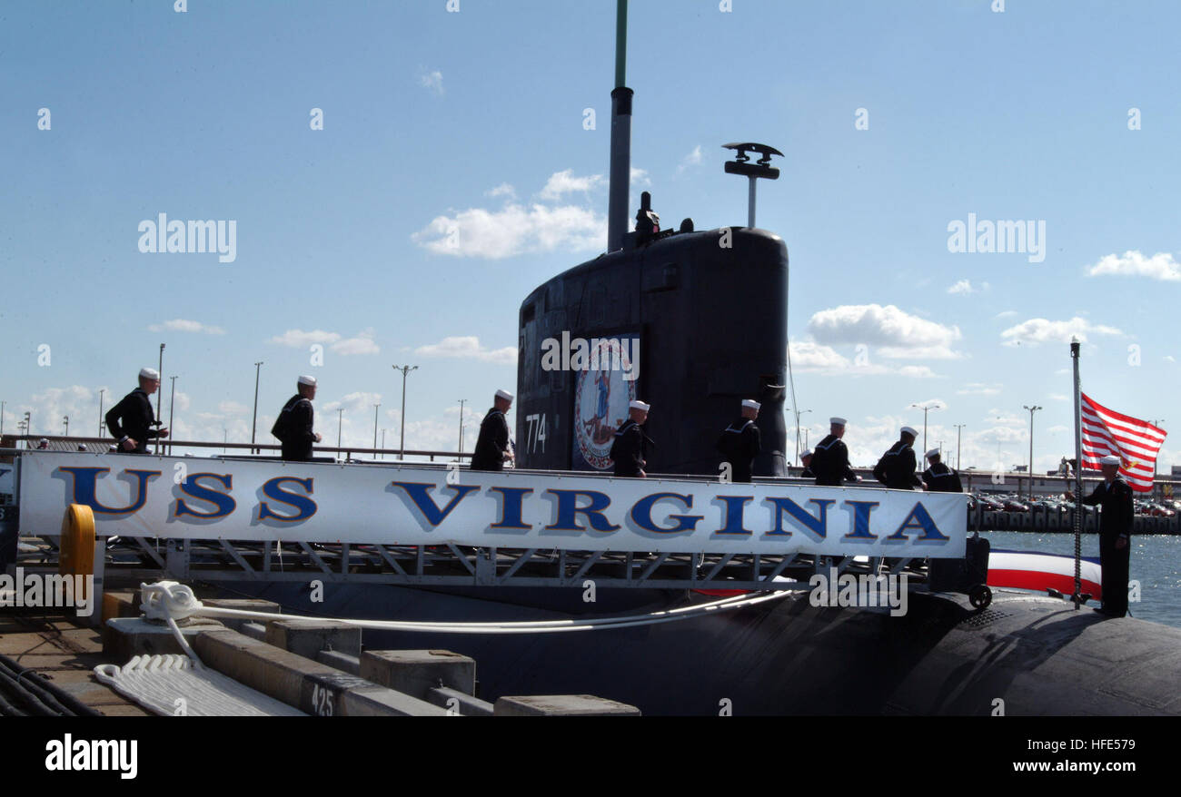 041023-N-2383B-150 Norfolk, Va. (Oct. 23, 2004) – The crew of USS Virginia (SSN 774) bring her to life as they board the newly commissioned first nuclear-powered fast attack Virginia class submarine and ninth U.S. naval vessel to be named for the 'Old Dominion'.  It is the Navy's only major combatant designed with the post-Cold War security environment in mind.  Virginia Class capabilities include anti-submarine; anti-surface; covert strike; covert special operations; covert mine; and covert intelligence, reconnaissance and electronic warfare.  U.S. Navy photo by Chief Photographer's Mate John Stock Photo