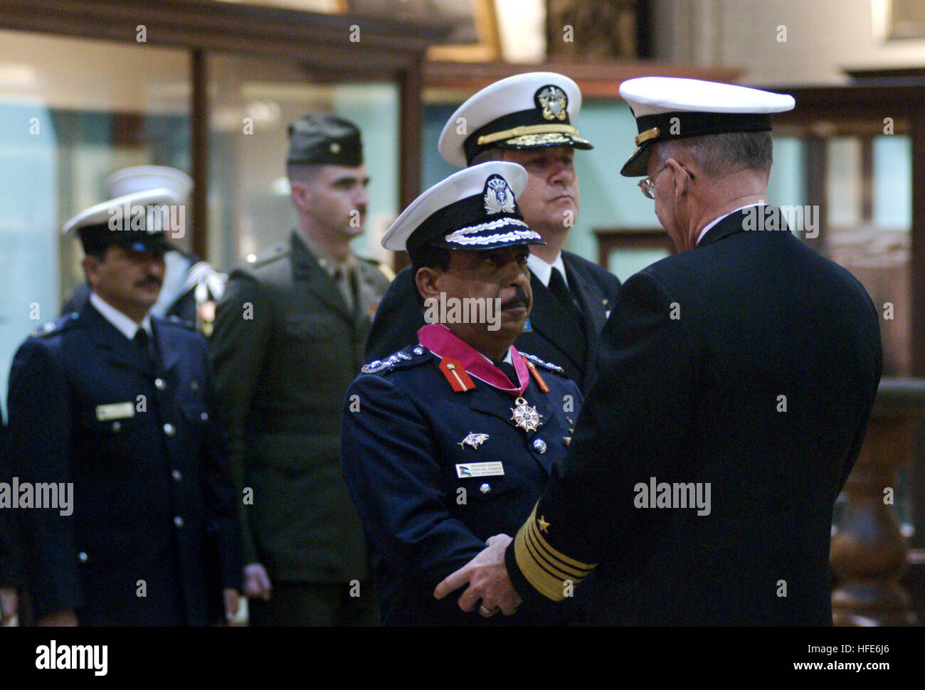 041207-N-2383B-023 Washington, D.C. (Dec. 7, 2004) - Brig. Gen. Dari Rajeb Al Zaben, Royal Jordanian Naval Force, is congratulated by Chief of Naval Operations (CNO) Adm. Vern Clark, after receiving the Legion of Merit. Brig. Gen. Al Zaben was recognized for his focused efforts to train Royal Jordanian Naval forces to enhance its terrorist intervention capabilities and the policing of Jordan's borders, resulting in stronger maritime security in the Red Sea. Brig. Gen. Al Zaben was given a full honors welcome ceremony recognizing his official visit to the United States. U.S. Navy photo by Chief Stock Photo