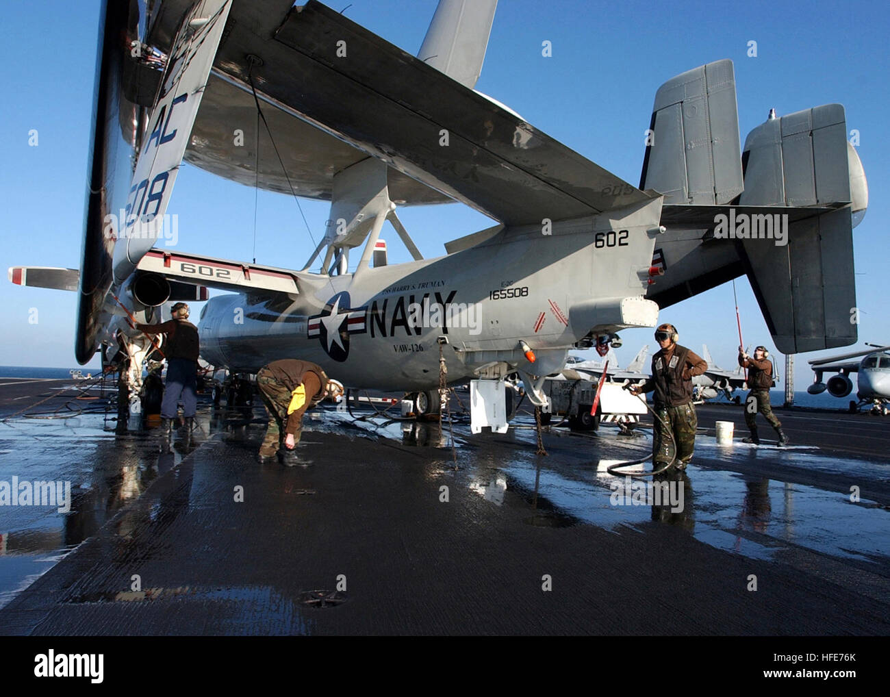 Sailors of Carrier Airborne Early Warning Squadron 126 (VAW-126) wash ...