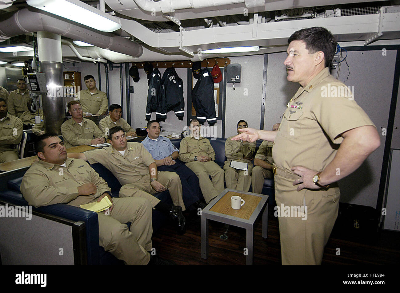 050131-N-3207B-018 Pearl Harbor, Hawaii (Jan. 31, 2005) - Master Chief Petty Officer of the Navy (MCPON) Terry Scott speaks to the chief petty officers (CPO), in the chief mess, during a visit to the Arleigh Burke-class guided missile destroyer USS Chafee (DDG 90). MCPON Scott explained the importance of the CPO core competencies and discussed how proper application and innovation will affect the future leaders of the Navy. MCPON Terry Scott visited various bases in Hawaii to speak to the Sailors about education, training, and the new Task Force Uniform concept. U.S. Navy photo by Photographer Stock Photo