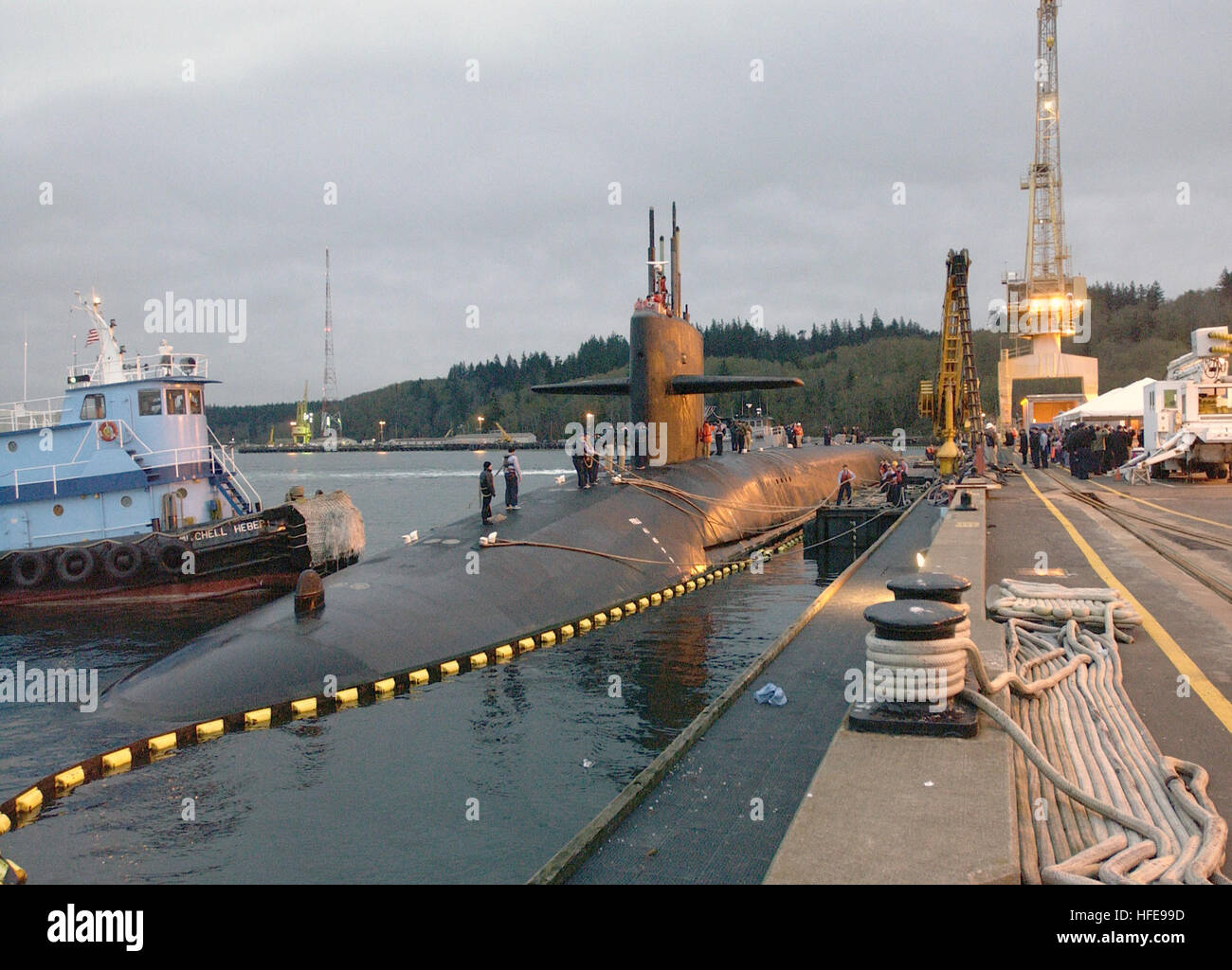 021122-N-6497N-006 Naval Submarine Base, Bangor Wash. (Nov. 22, 2002) -- The crew of the USS Kentucky (SSBN 737) arrives at their new homeport for the first time as the boat is guided in to the Delta Pier. U.S. Navy photo by Brian Nokell.  (RELEASED) US Navy 021122-N-6497N-006 USS Kentucky (SSBN 737) arrives at their new homeport Stock Photo
