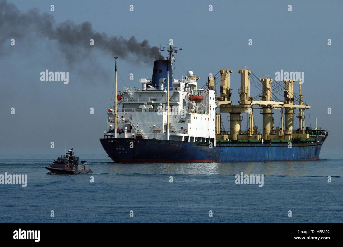 050224-N-6932B-026 Port of Ash Shuaiba, Kuwait (Feb. 24, 2005) - A U.S. Navy patrol boat, assigned to Inshore Boat Unit Two Four (IBU-24), Naval Coastal Warfare (NCW) Squadron Two Five, escorts a ship out of the Port of Ash Shuaiba, Kuwait. NCW Squadron 25 is currently on a regularly scheduled deployment defending U.S. and coalition assets transiting the North Persian Gulf in support of Operation Iraqi Freedom (OIF). U.S. Navy photo by Photographer's Mate 1st Class Richard J. Brunson (RELEASED) US Navy 050224-N-6932B-026 A U.S. Navy patrol boat, assigned to Inshore Boat Unit Two Four (IBU-24), Stock Photo