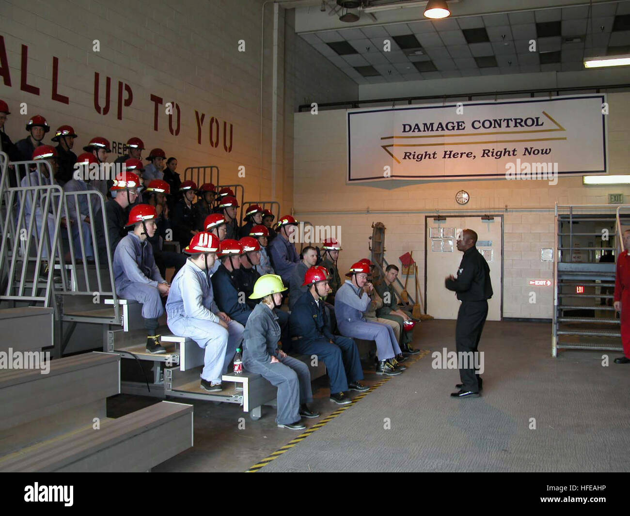 Damage Controlman instructs Sailors on safety procedures during the ...