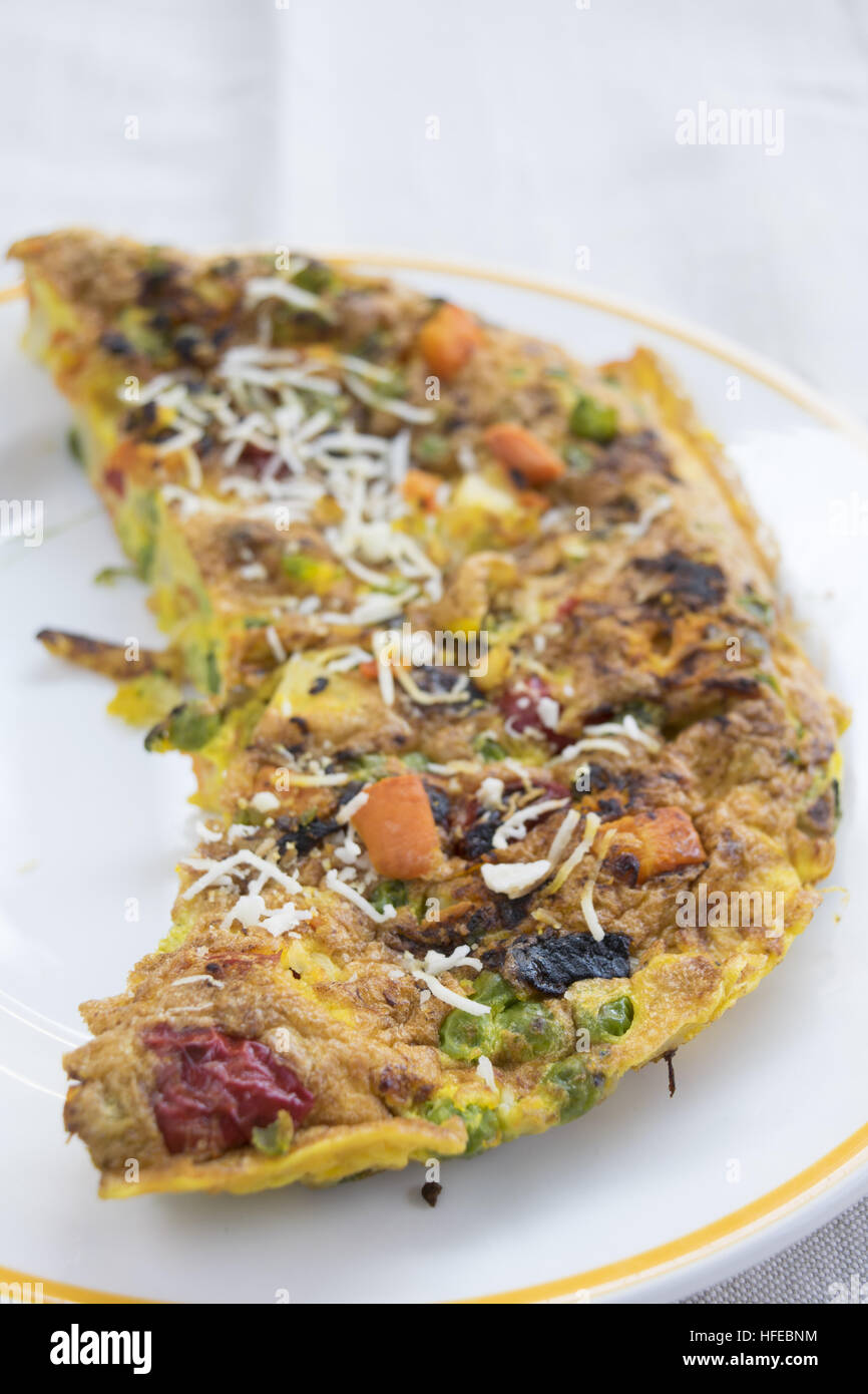 omelette with variety of vegetables and parmesan Stock Photo