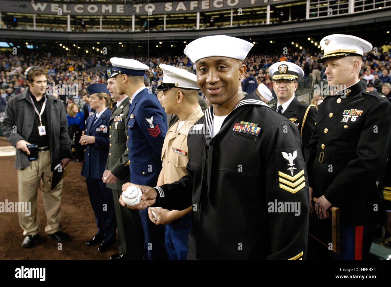 050405-N-6477M-340 Seattle, Wash. (Apr. 5, 2005) Ð Hospital Corpsman 1st Class Jermaine K. Williams, assigned to Naval Hospital Bremerton, Wash., prepares to take the field to throw the first pitch during the ÒBoeing Salute to Armed Forces NightÓ at SAFCO Field, Seattle Wash. The Mariners home season opening game was preceded by performances of the Joint Forces Band Northwest, U.S Marine Corps Drill Team, parading of the colors by Joint Forces Color Guard and the presentation of a 72 x 48 foot U.S. Flag by the U.S. Coast Guard. The U.S. Navy Band Vocal Quartet sang the National Anthem. U.S. Na Stock Photo